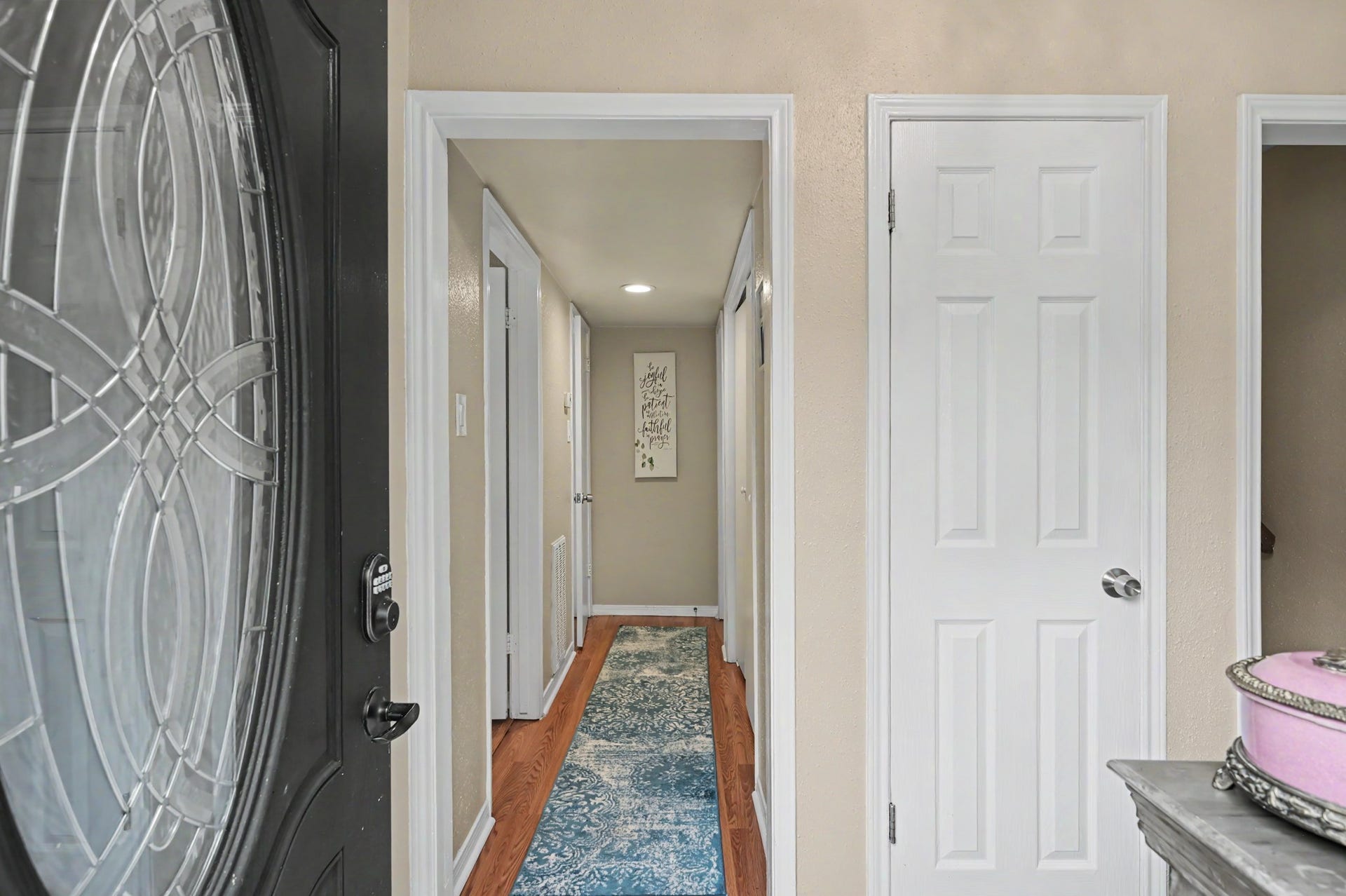 Upon entering the front door, youll find the stairs and primary bedroom to your right, with two additional bedrooms, a convenient laundry closet, and a full bathroom located straight ahead.