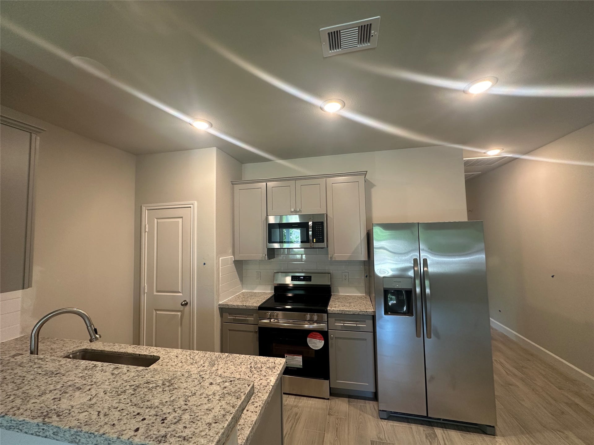 104 Turner Drive, Willis, TX 77378 Unit A; open flow kitchen with large pantry and plenty of cabinet storage.