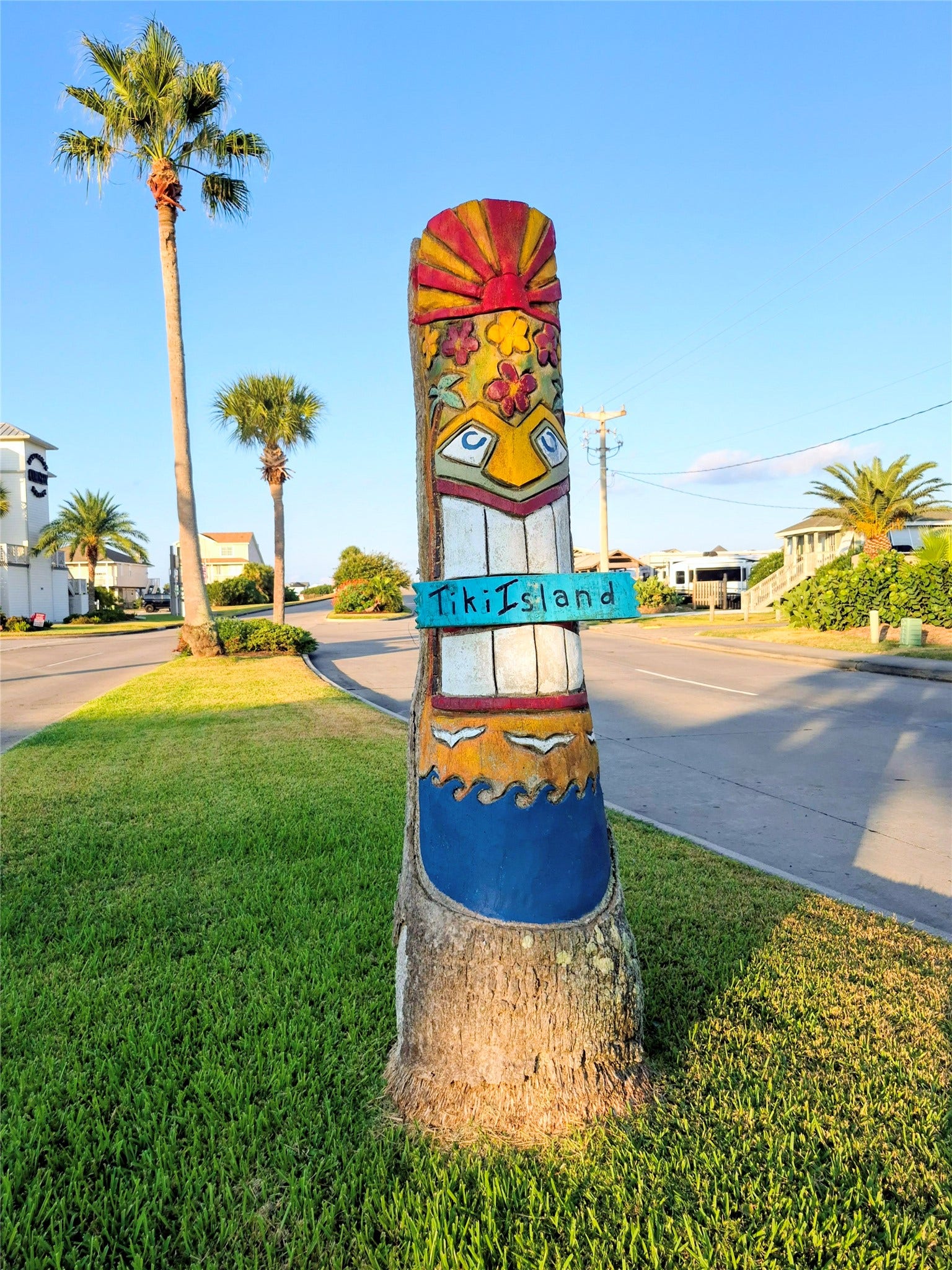 TBD Lot 28 Tiki Drive, Tiki Island, TX 77554 Palms into decorated totem poles