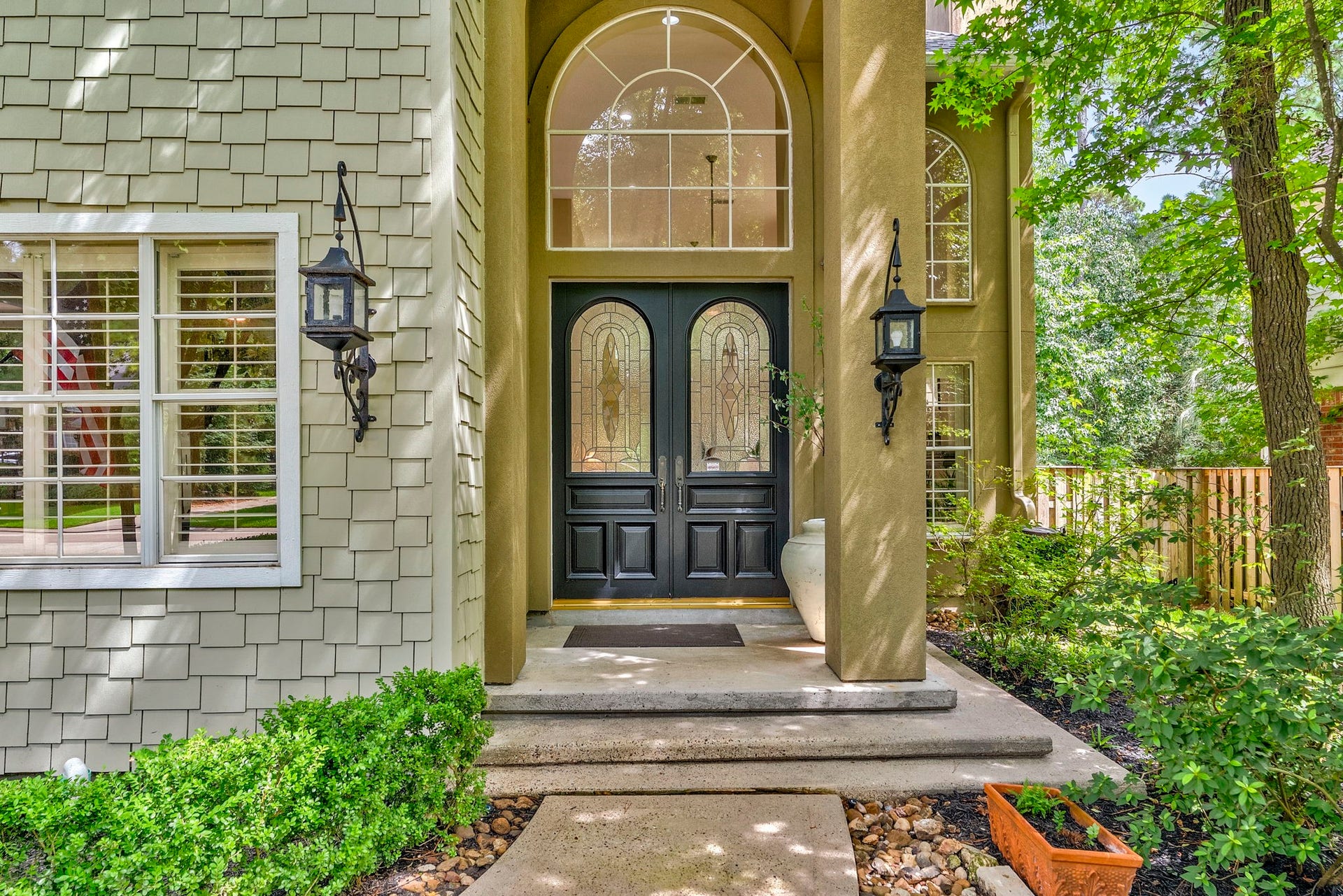 66 Candle Pine Place, The Woodlands, TX 77381 Beautiful curb appeal with a welcoming entry.