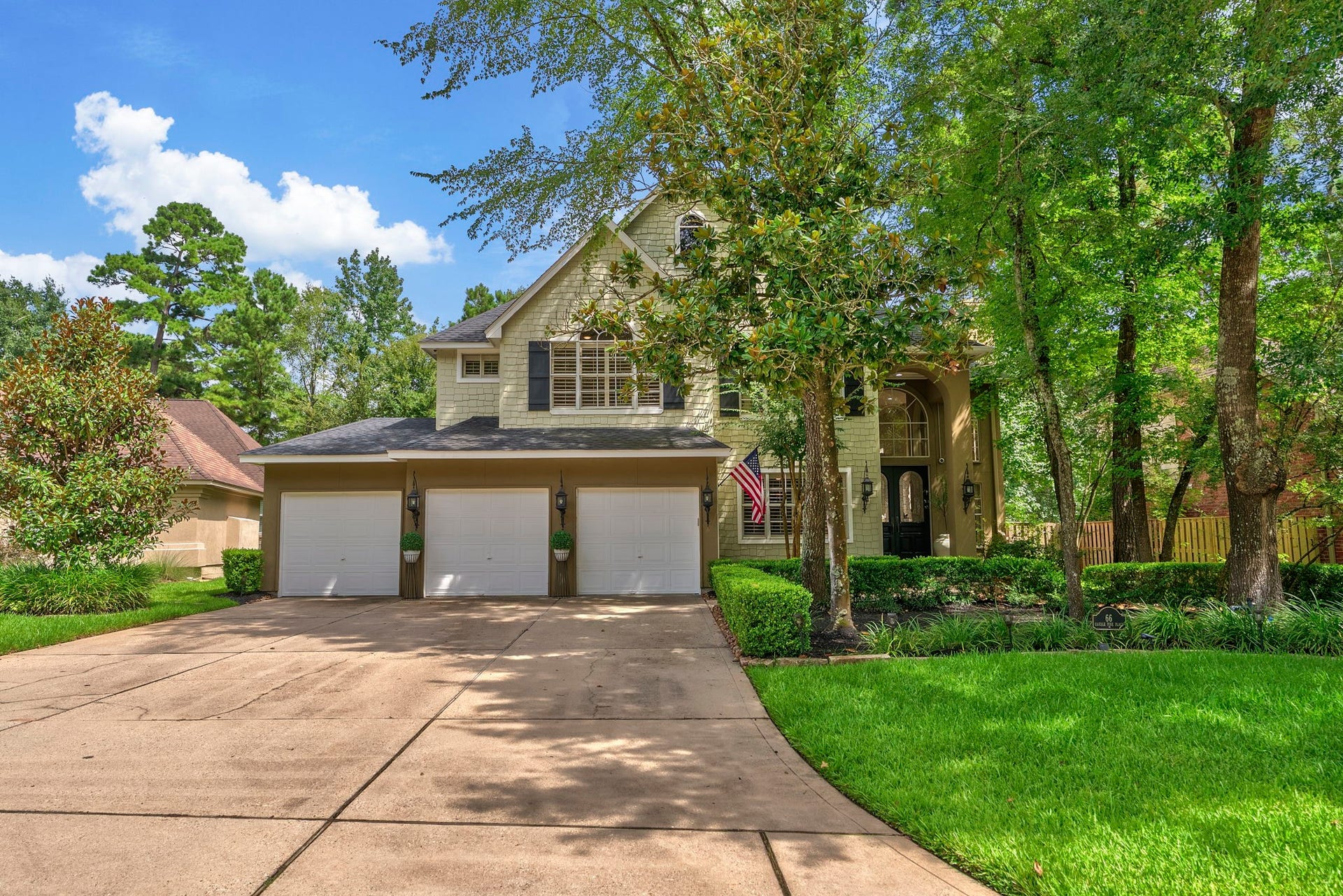 66 Candle Pine Place, The Woodlands, TX 77381 Welcome Home! True 3 Car Garage with a triple wide driveway. There is an Electric Car charger available, too.