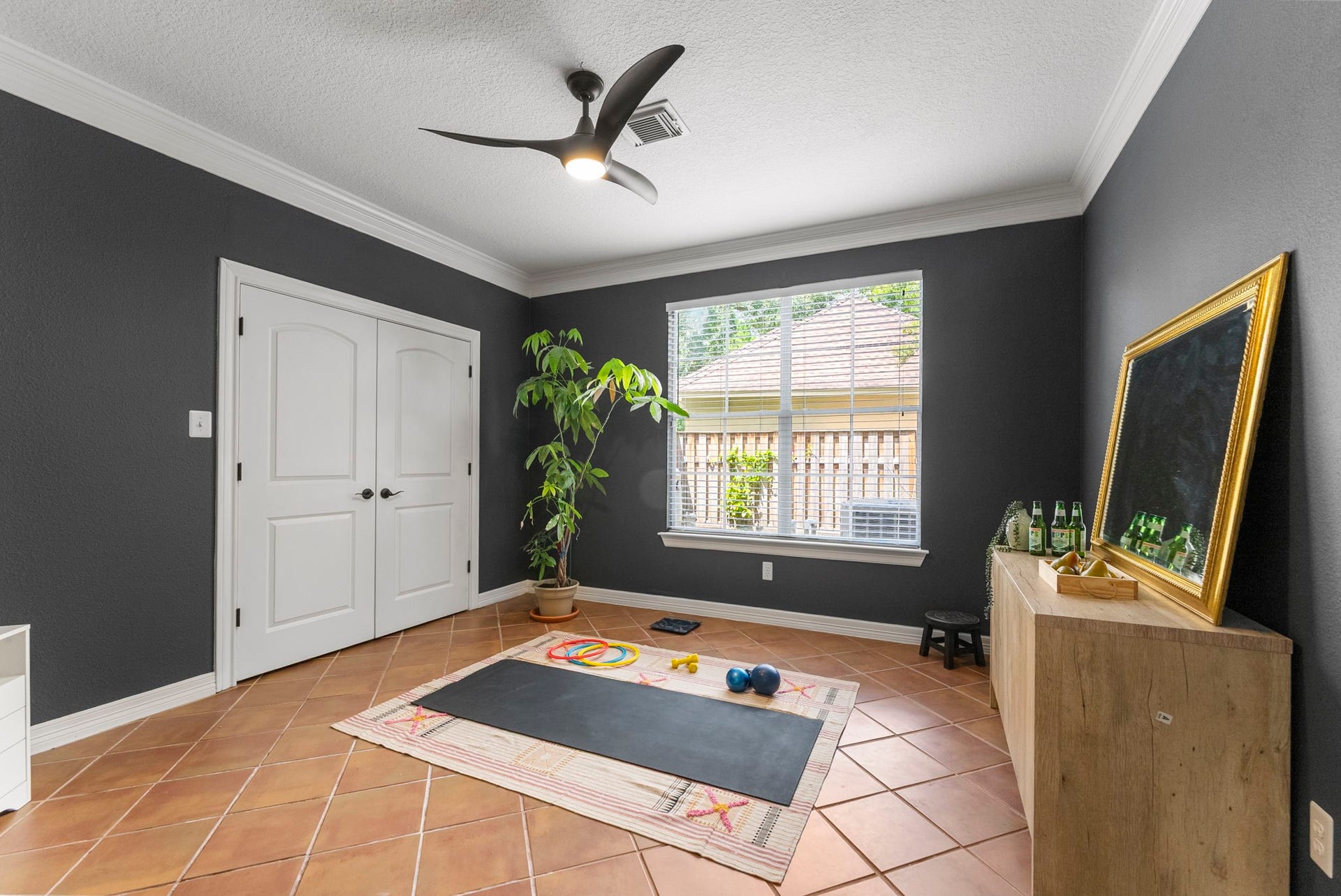 66 Candle Pine Place, The Woodlands, TX 77381 This extra room is being used as an workout room, but can be easily used as a Bedroom with the large closet available.