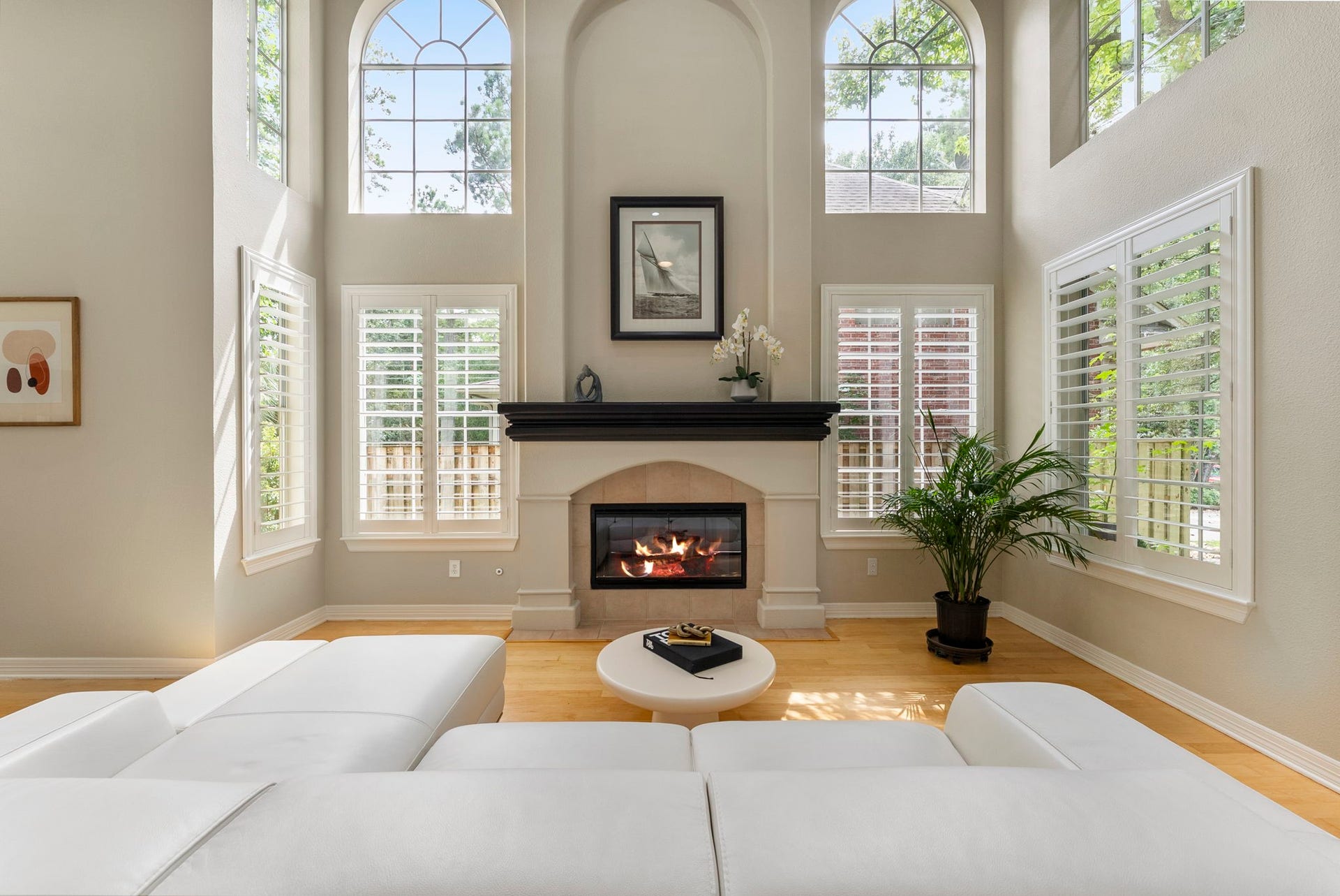 66 Candle Pine Place, The Woodlands, TX 77381 The Formal Living room offers a focal gas log fireplace surrounded by windows.