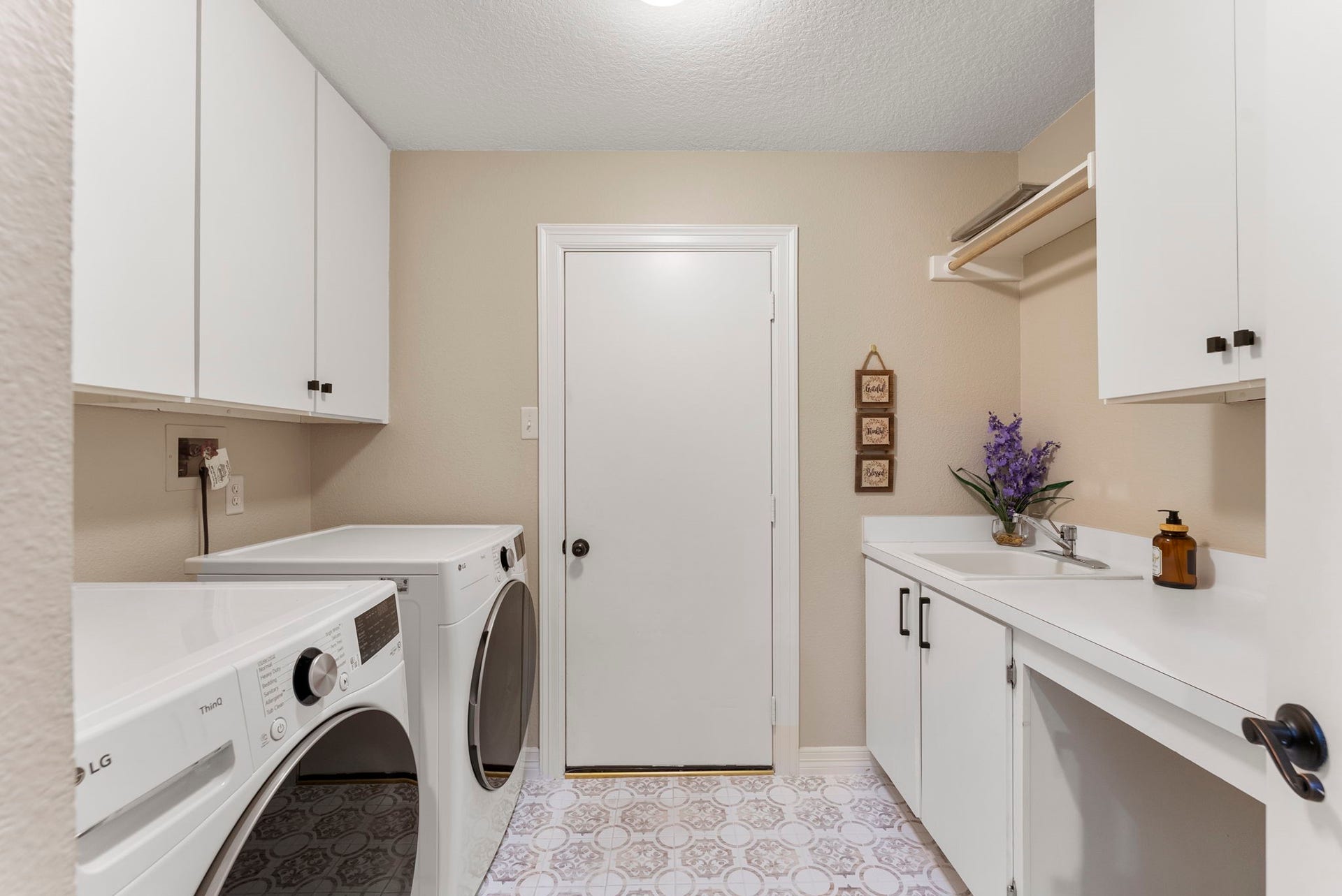 66 Candle Pine Place, The Woodlands, TX 77381 To complete the first floor is the Utility room, which provides additional storage and access to the garage.
