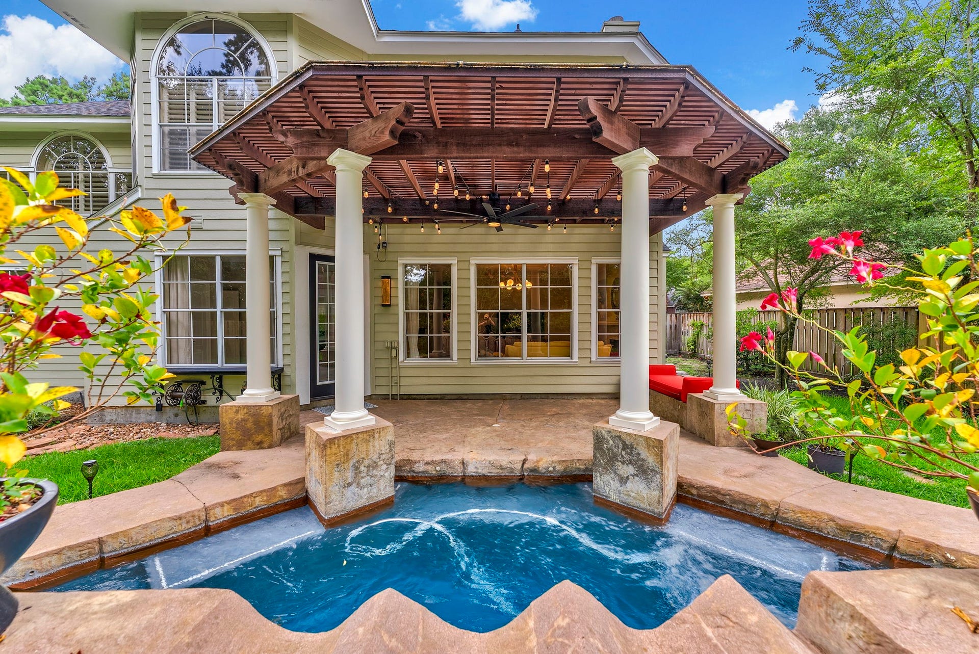 66 Candle Pine Place, The Woodlands, TX 77381 The covered patio provides extra shade for space to enjoy being outside.