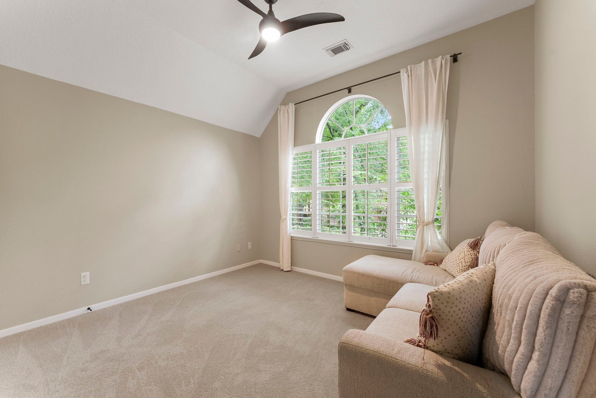66 Candle Pine Place, The Woodlands, TX 77381 This secondary bedroom has a large window overlooking the front of the home.
