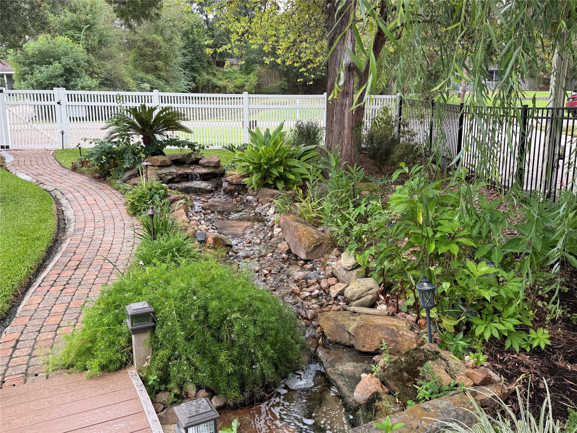 16372 Lochness Dr Drive, Willis, TX 77318 This water feature