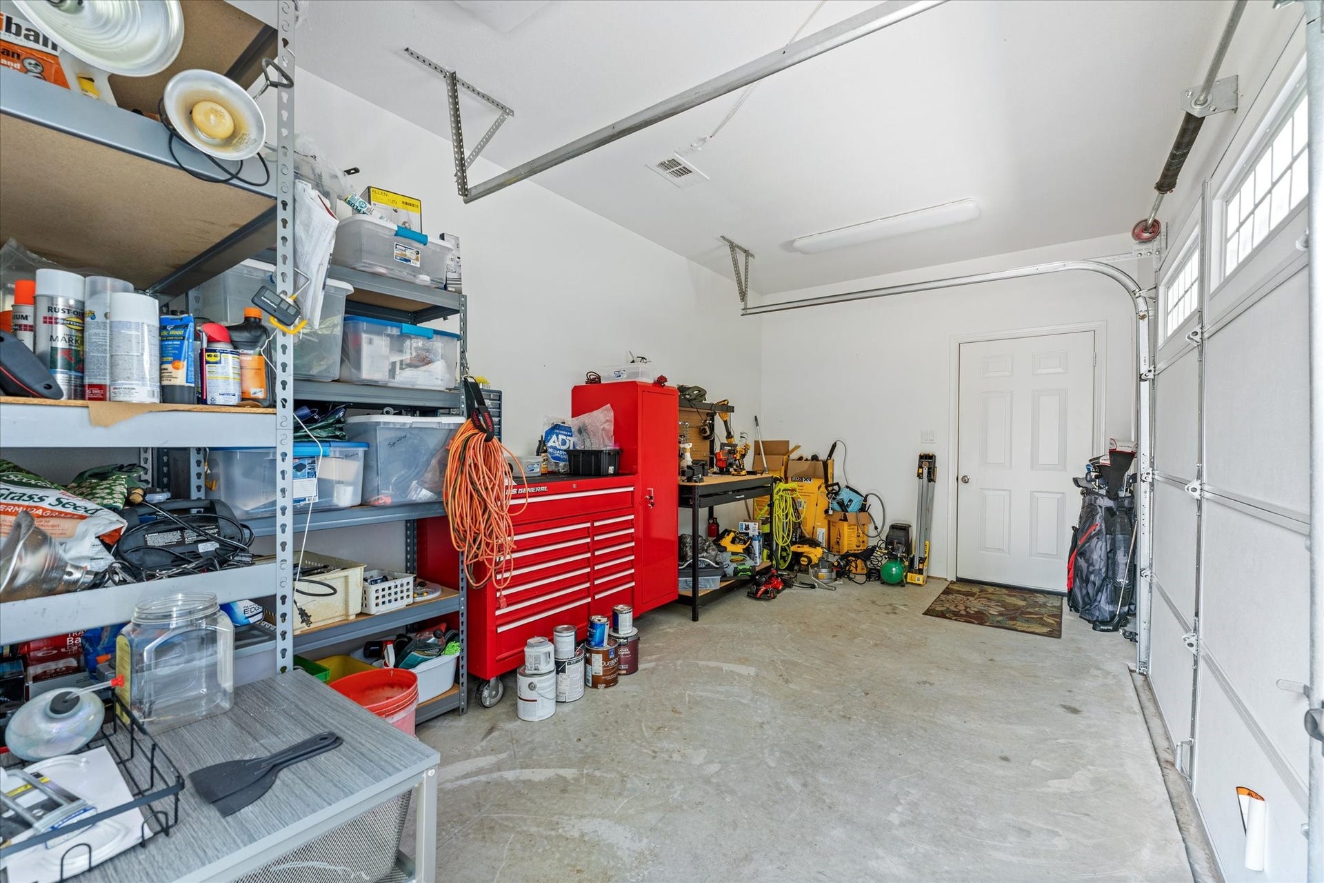 16372 Lochness Dr Drive, Willis, TX 77318 Air Conditioned Work Shop w/full sized garage door.