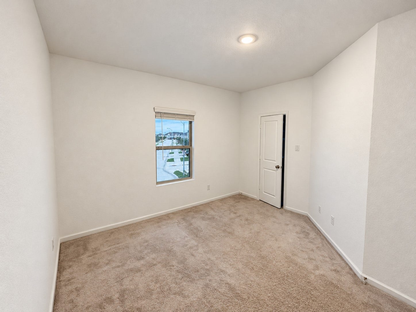 12. Additional bedroom offers flexible space for guests, hobbies, or everyday use.