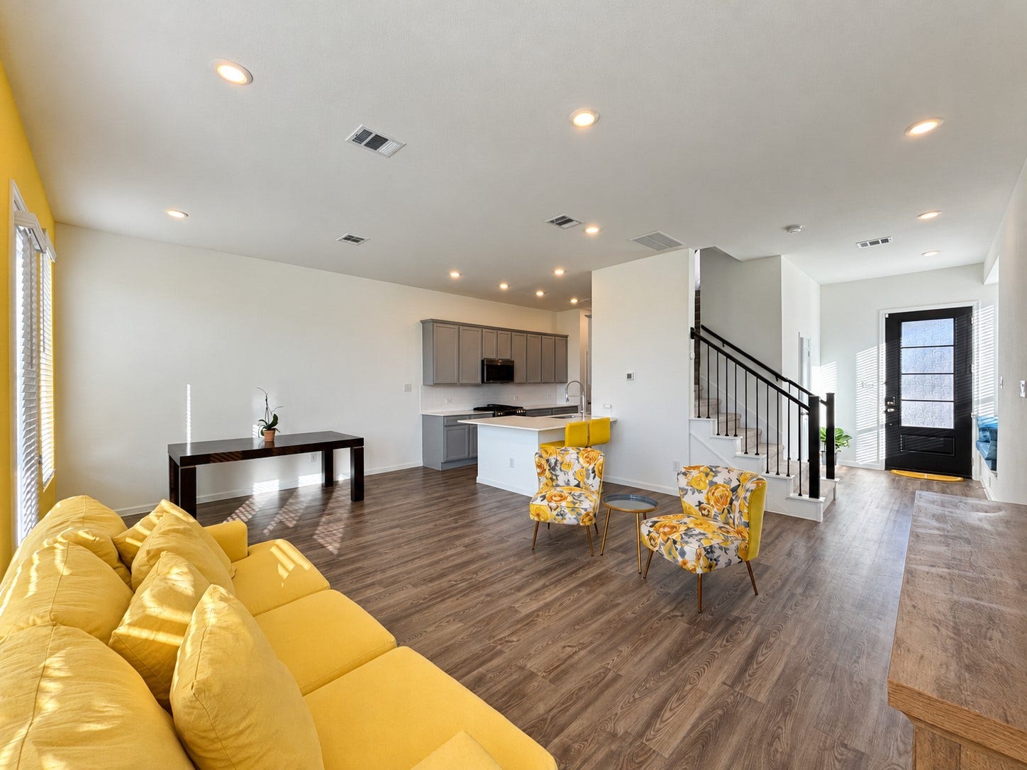 5. Reverse view highlighting the connected living, dining, and kitchen spaces.