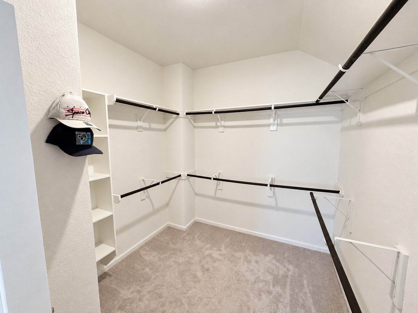 10. Walk-in closet with wraparound shelving and hanging space.