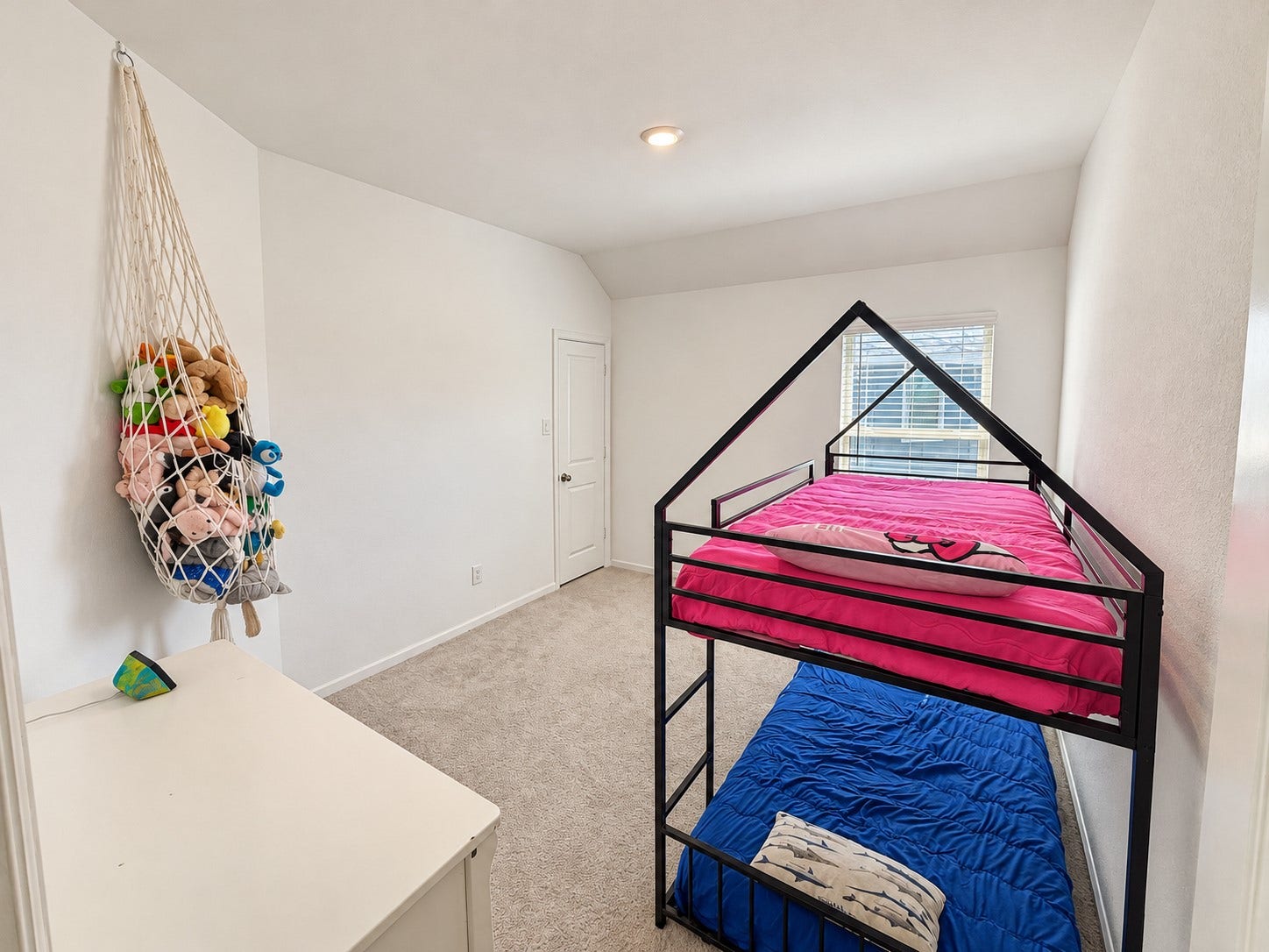 11. Secondary bedroom shown with bunk beds and space for additional furnishings.