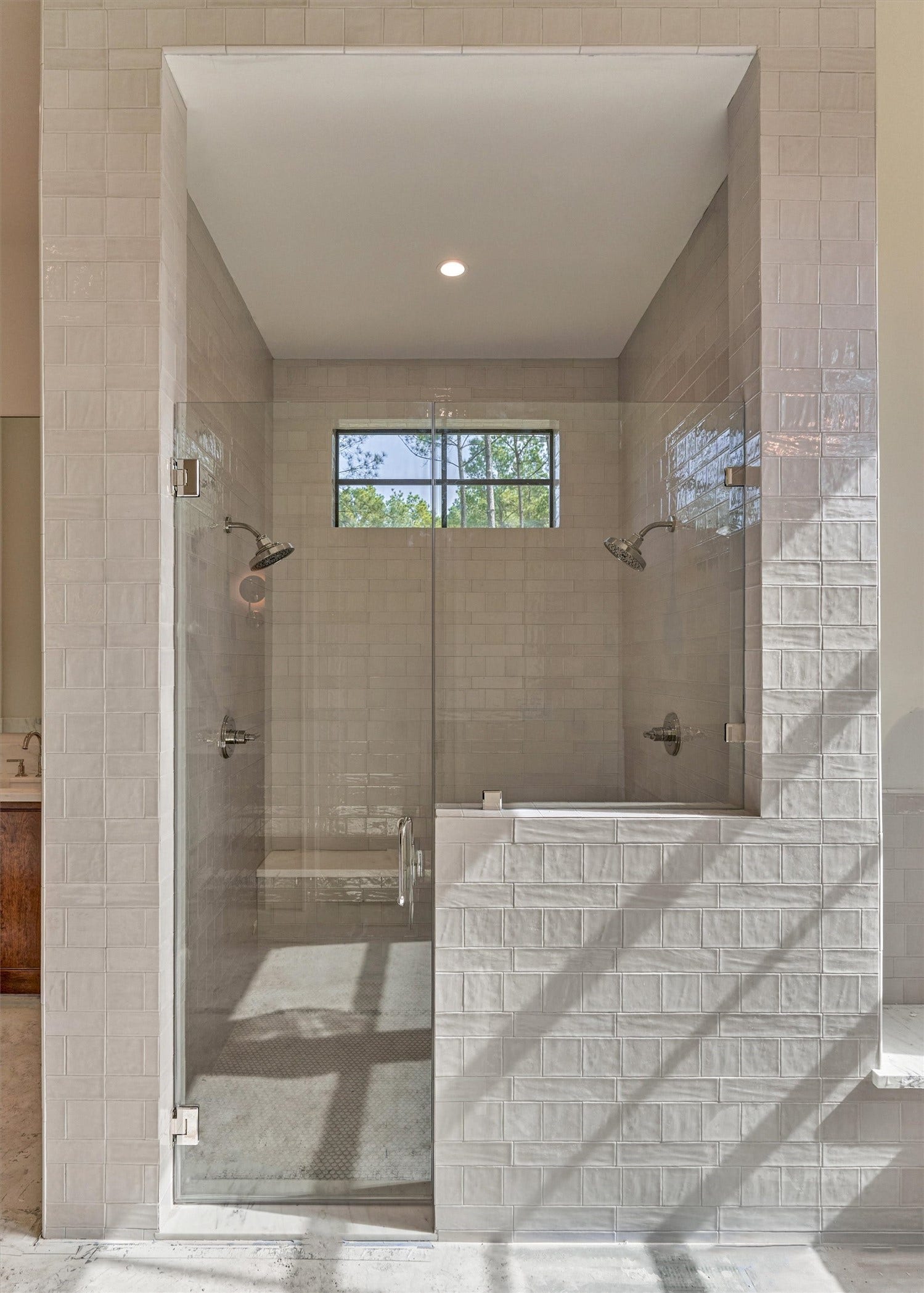 4800 Hawk Canyon Court, Montgomery, TX 77316 An abundance of natural light enhances the timeless elegance of this primary bath.