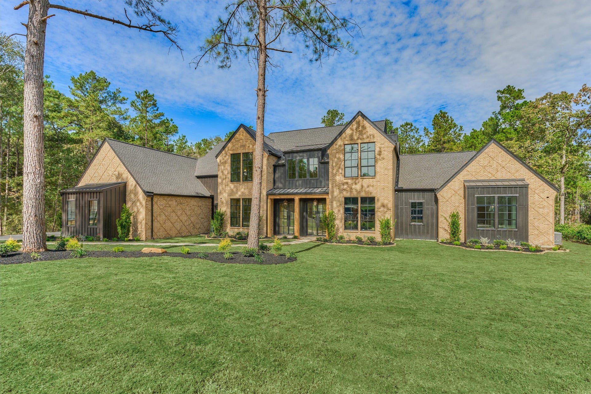 4800 Hawk Canyon Court, Montgomery, TX 77316 The homes impressive front elevation, highlighting it's premium exterior finishes and welcoming entry designed to make a lasting impression.
