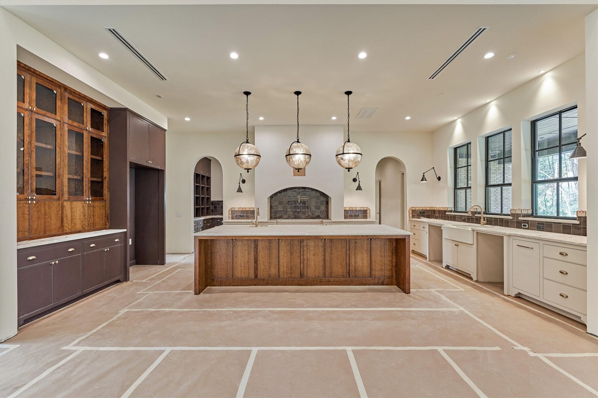 4800 Hawk Canyon Court, Montgomery, TX 77316 Expansive custom cabinetry, large island with bar seating that tucks neatly underneath for clean, open flow and well appointed layout. Instant hot water tap added for convenience.