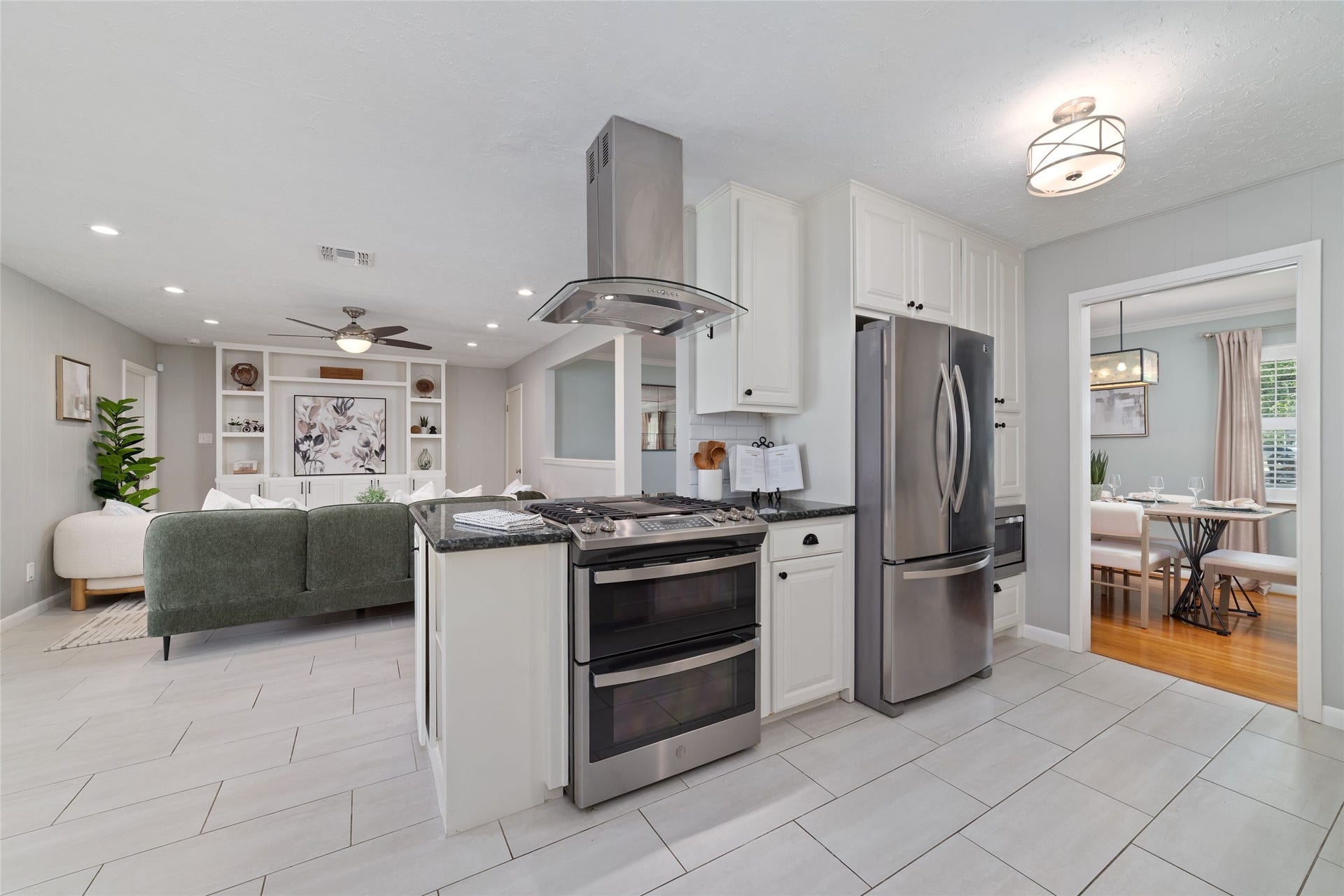 2127 Lazybrook Drive, Houston, TX 77008 The kitchen flows into the living room, creating an inviting layout thats perfect for entertaining.