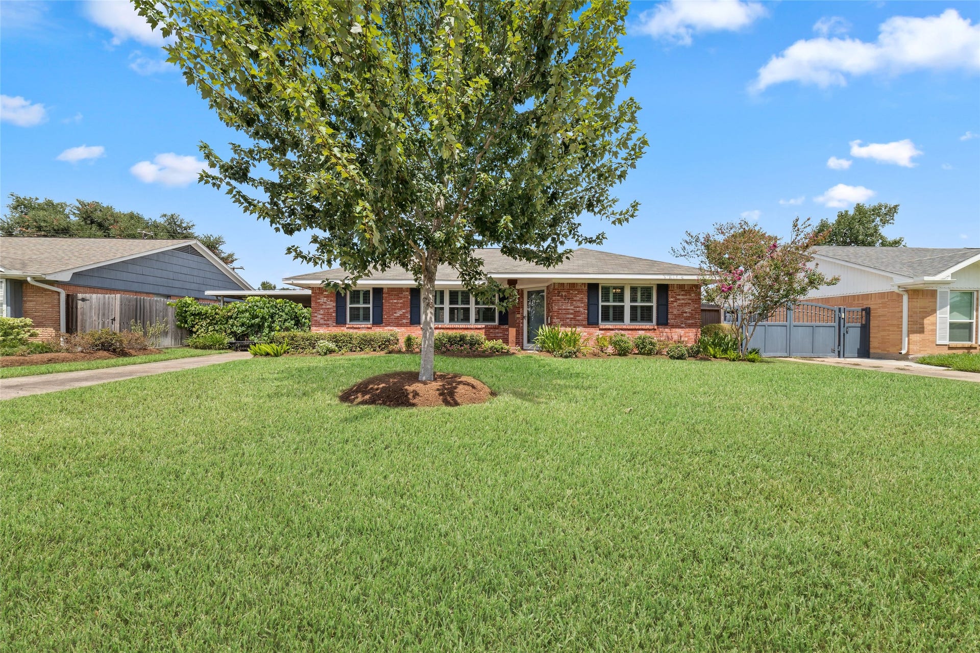 2127 Lazybrook Drive, Houston, TX 77008 Charming brick ranch-style home with a spacious front yard and mature tree, offering great curb appeal
