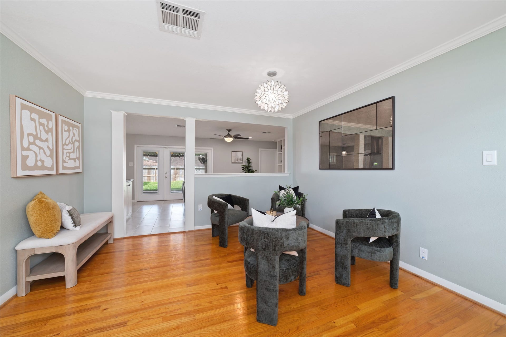 2127 Lazybrook Drive, Houston, TX 77008 Den area has an open flow into the adjacent living and dining areas. Perfect for comfortable gatherings and effortless entertaining.