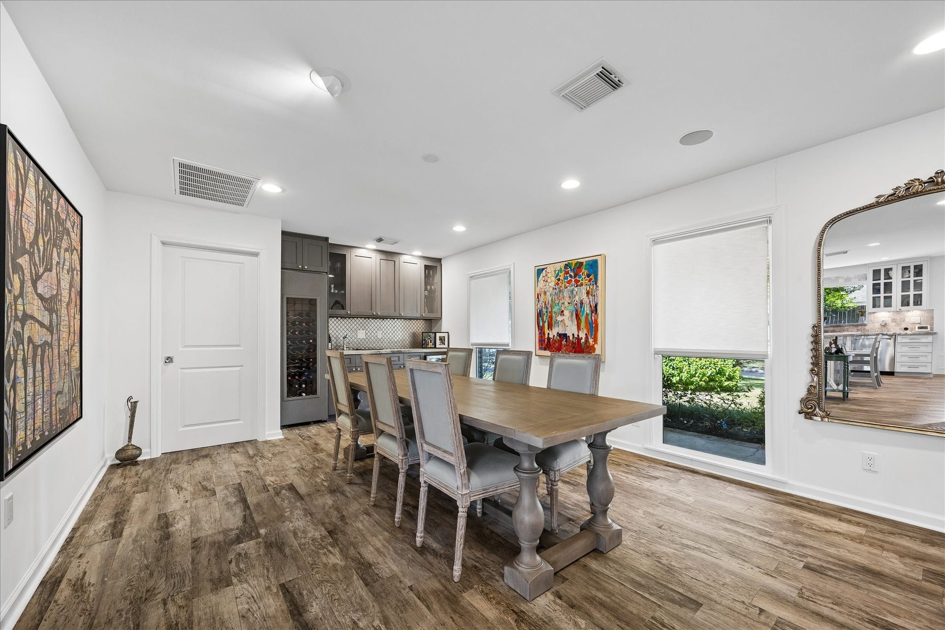 4703 Banning Drive, Houston, TX 77027 Spacious dining area features wood flooring, recessed lighting & large windows overlooking the front lawn. Built-in cabinetry w/wine storage, beverage refrigerator & gorgeous tile backsplash and countertop provides a convenient serving area for entertaining.