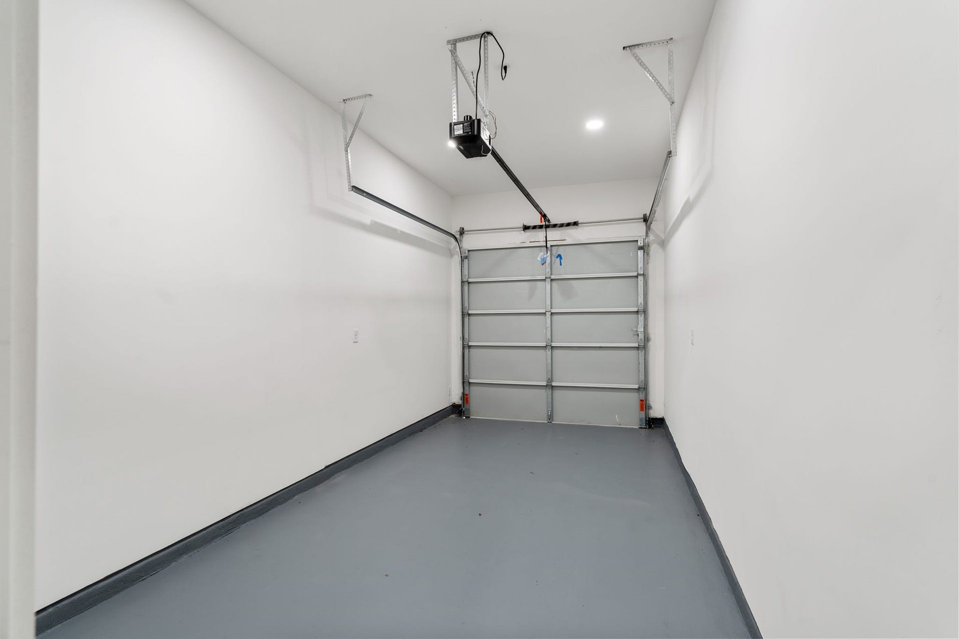 View of the one car garage. With entry directly in to the living room. Garage floors are completed with epoxy floors.