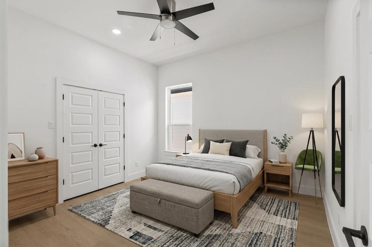Elegant bedroom featuring a plush ,upholstered bed, modern nightstands, and a cozy sitting area, all enhanced by soft lighting and a neutral color palette.