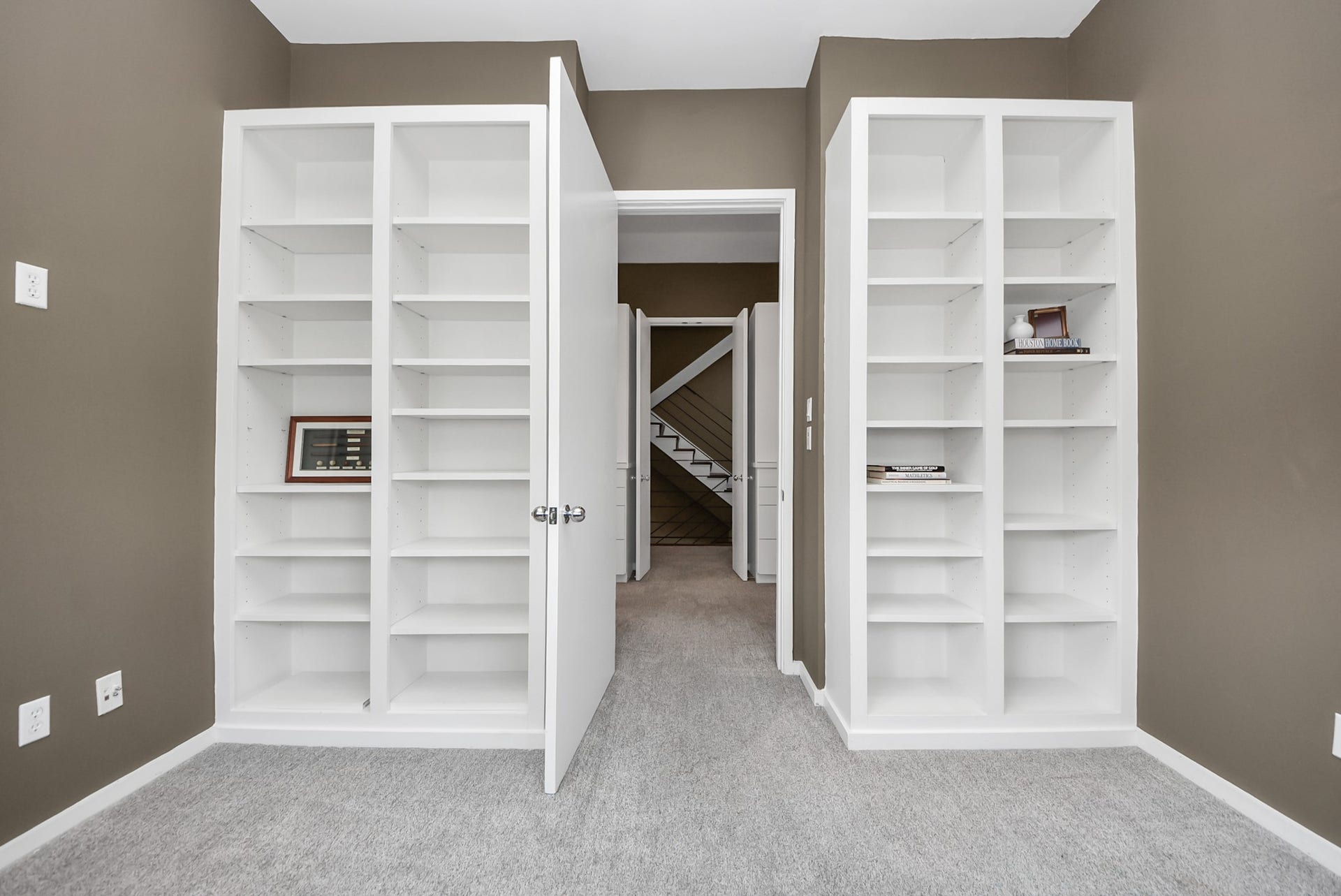 6519 Durford Street, Houston, TX 77007 Office with custom-built shelving for added storage and organization.