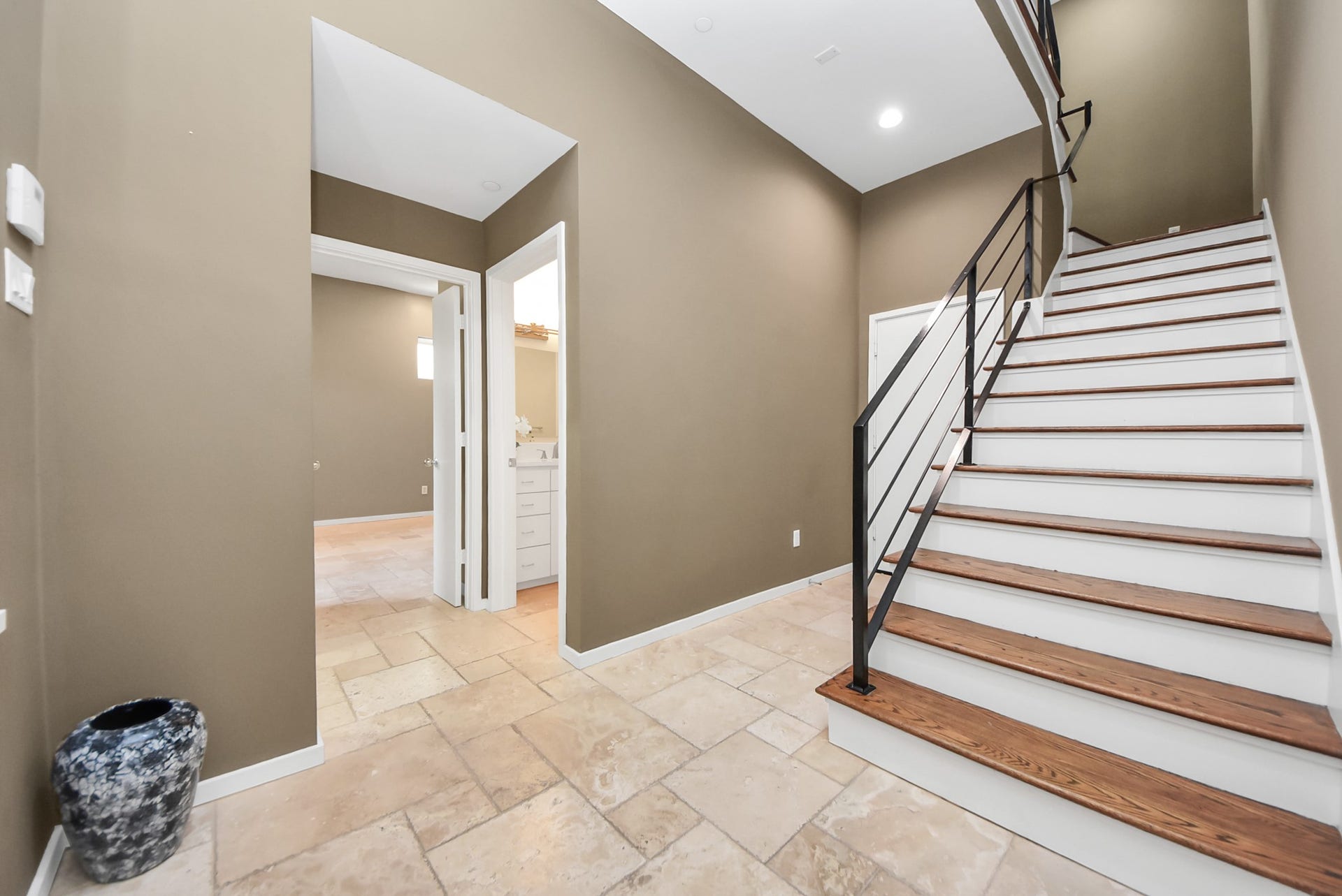 6519 Durford Street, Houston, TX 77007 Welcoming first-floor entry with staircase leading to the second level, offering a clean and modern transition between spaces.