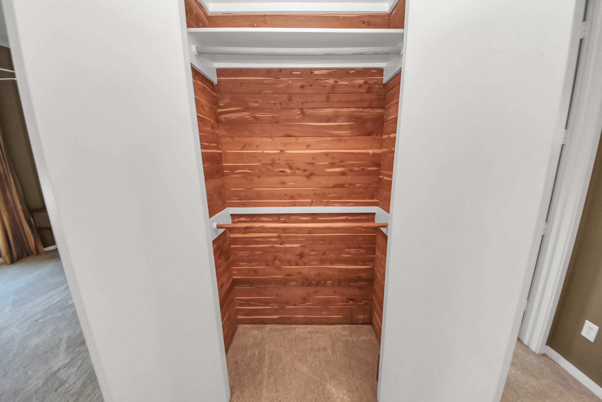 6519 Durford Street, Houston, TX 77007 Custom closet featuring built-in shelving with cedar wood finish