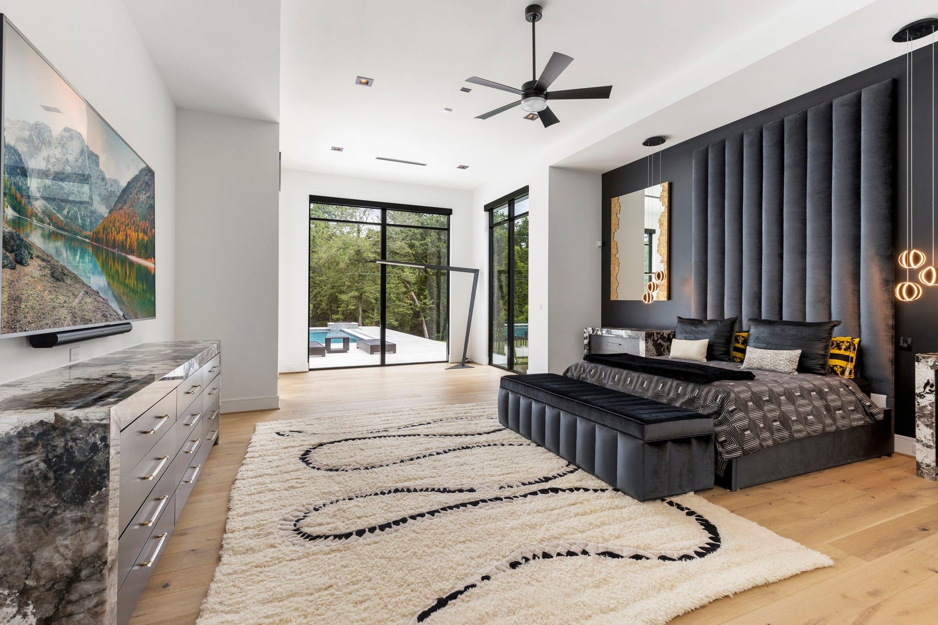The primary suite is a striking blend of modern sophistication and serene comfort.