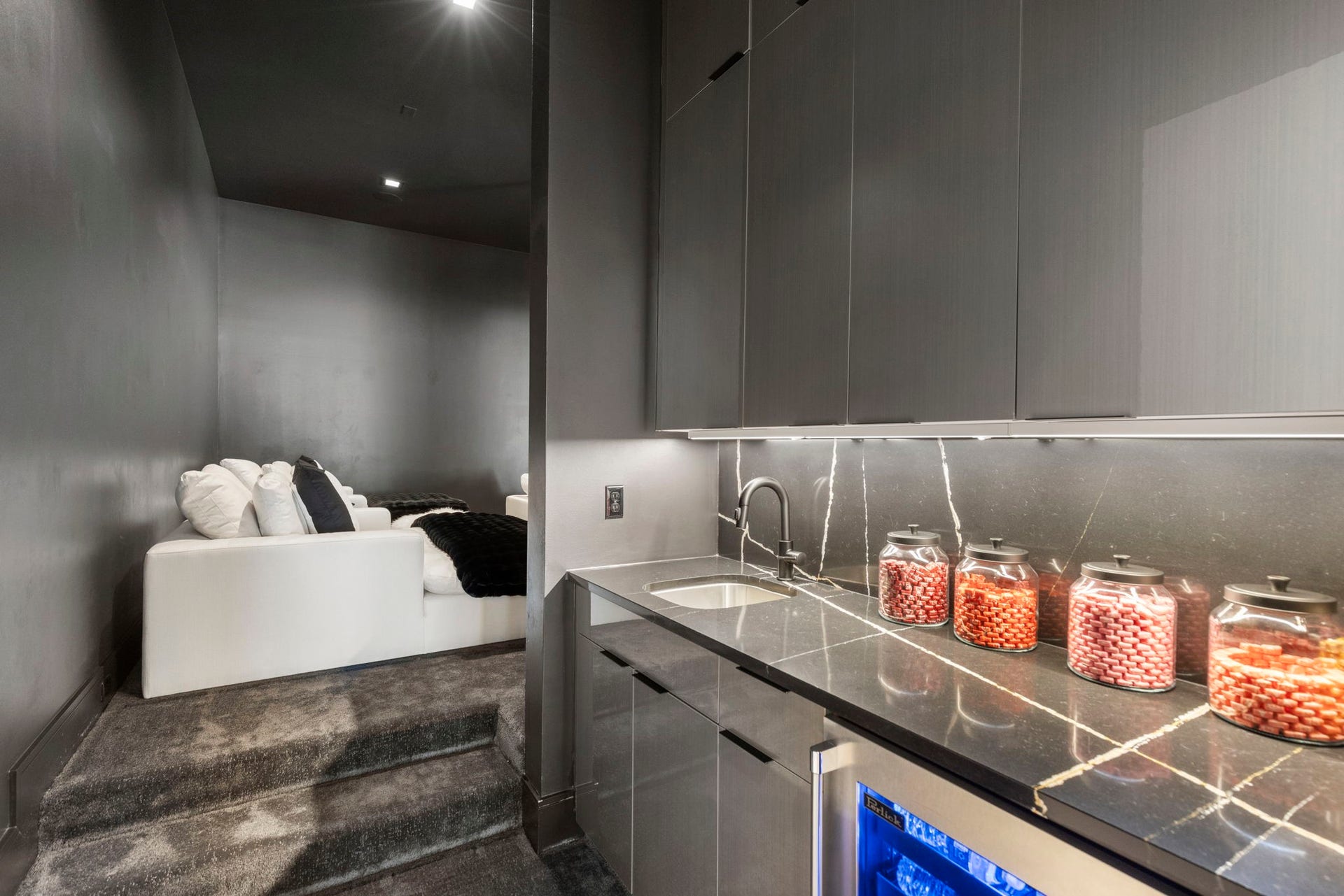 First floor media features a kitchenette complete with drink fridge.