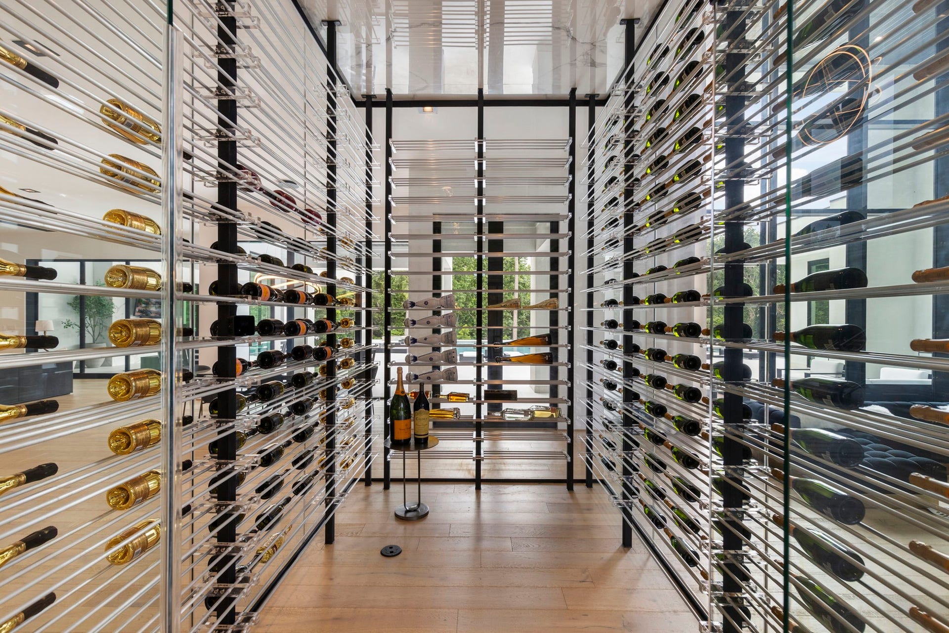 The wine cellar is centrally located on the first floor, and serves as a sophisticated gallery visible from all of the main living spaces, easily storing 800 of your favorite vintages.