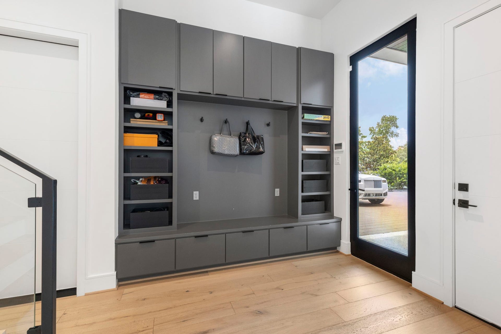 Side door entry and mud area is convenient to the utility room and home elevator.