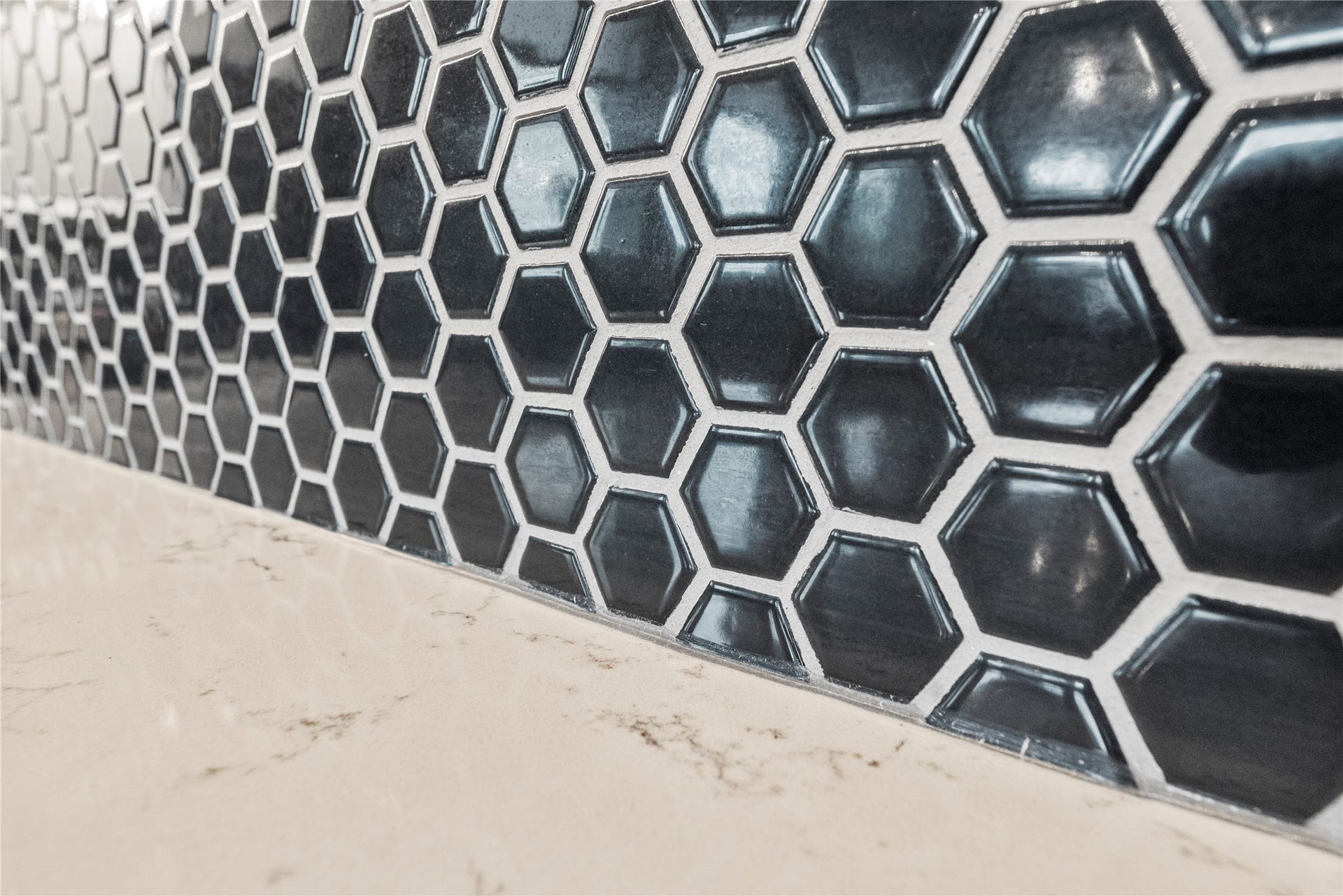 3127 Swift Way, Katy, TX 77493 Elegant hexagonal tile backsplash adds a modern touch to the sleek countertop.