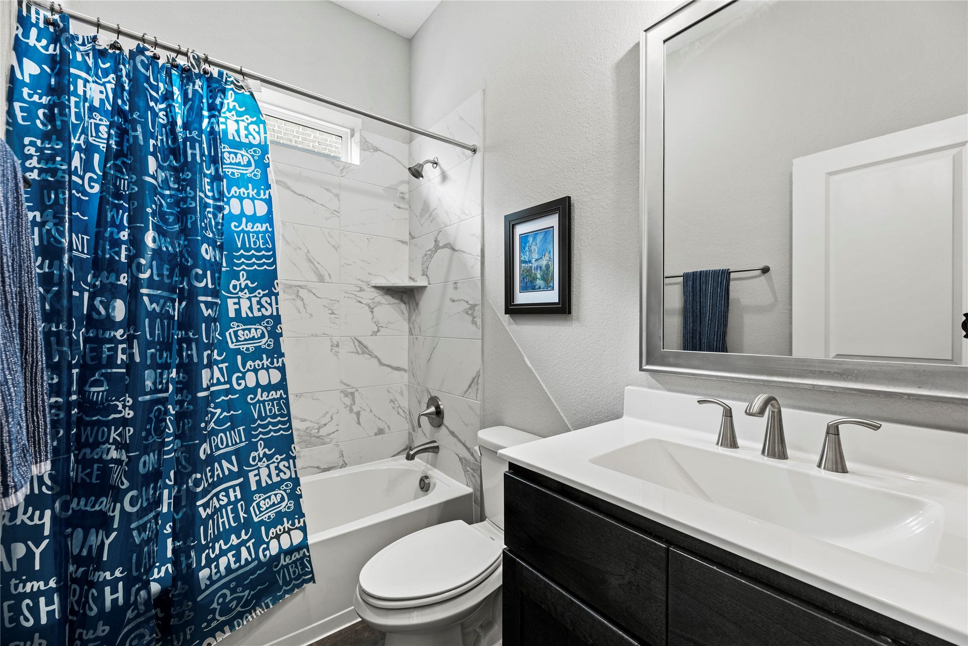 3127 Swift Way, Katy, TX 77493 Modern third bathroom featuring a sleek vanity, stylish fixtures, complemented by elegant tile in the shower area.