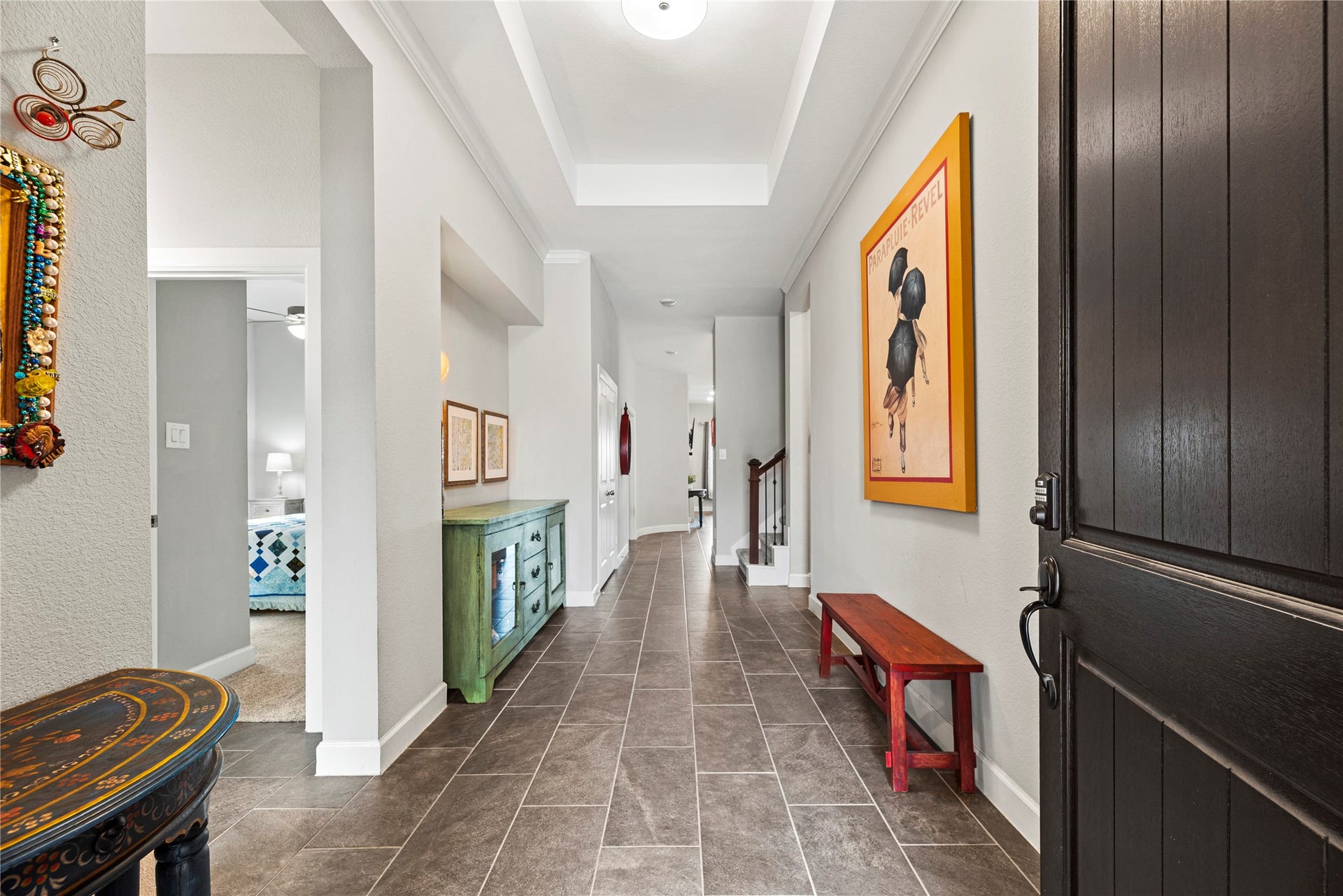 3127 Swift Way, Katy, TX 77493 Step into a welcoming hallway featuring elegant tile flooring and soaring ceilings!