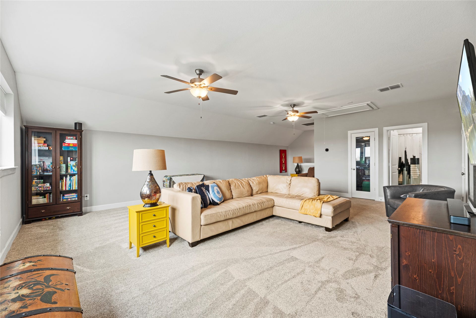 3127 Swift Way, Katy, TX 77493 Spacious and inviting game room/flex area featuring plush carpeting and ample natural light. Perfect for relaxation and entertainment.
