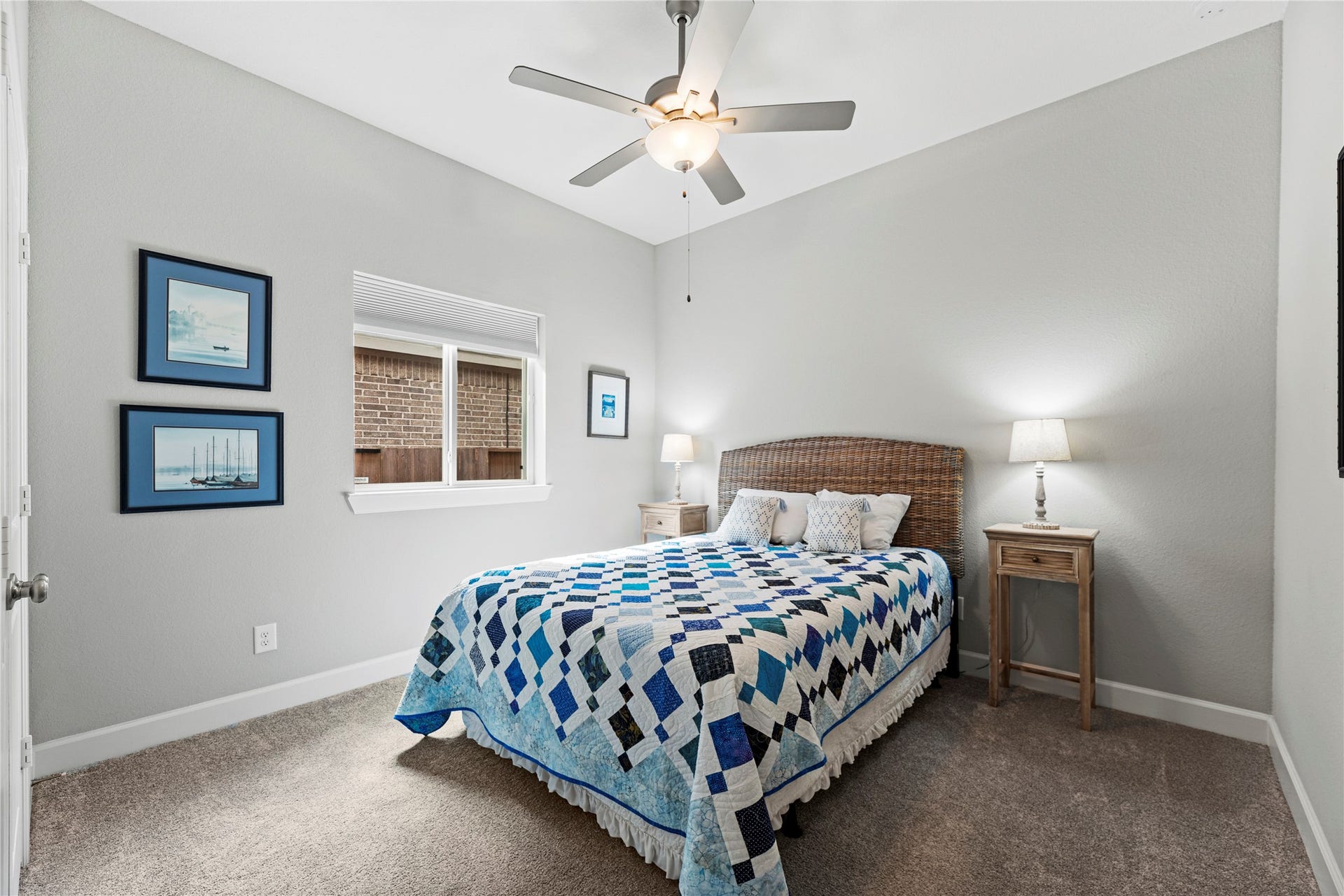 3127 Swift Way, Katy, TX 77493 Cozy secondary bedroom featuring soft gray walls and a stylish ceiling fan.