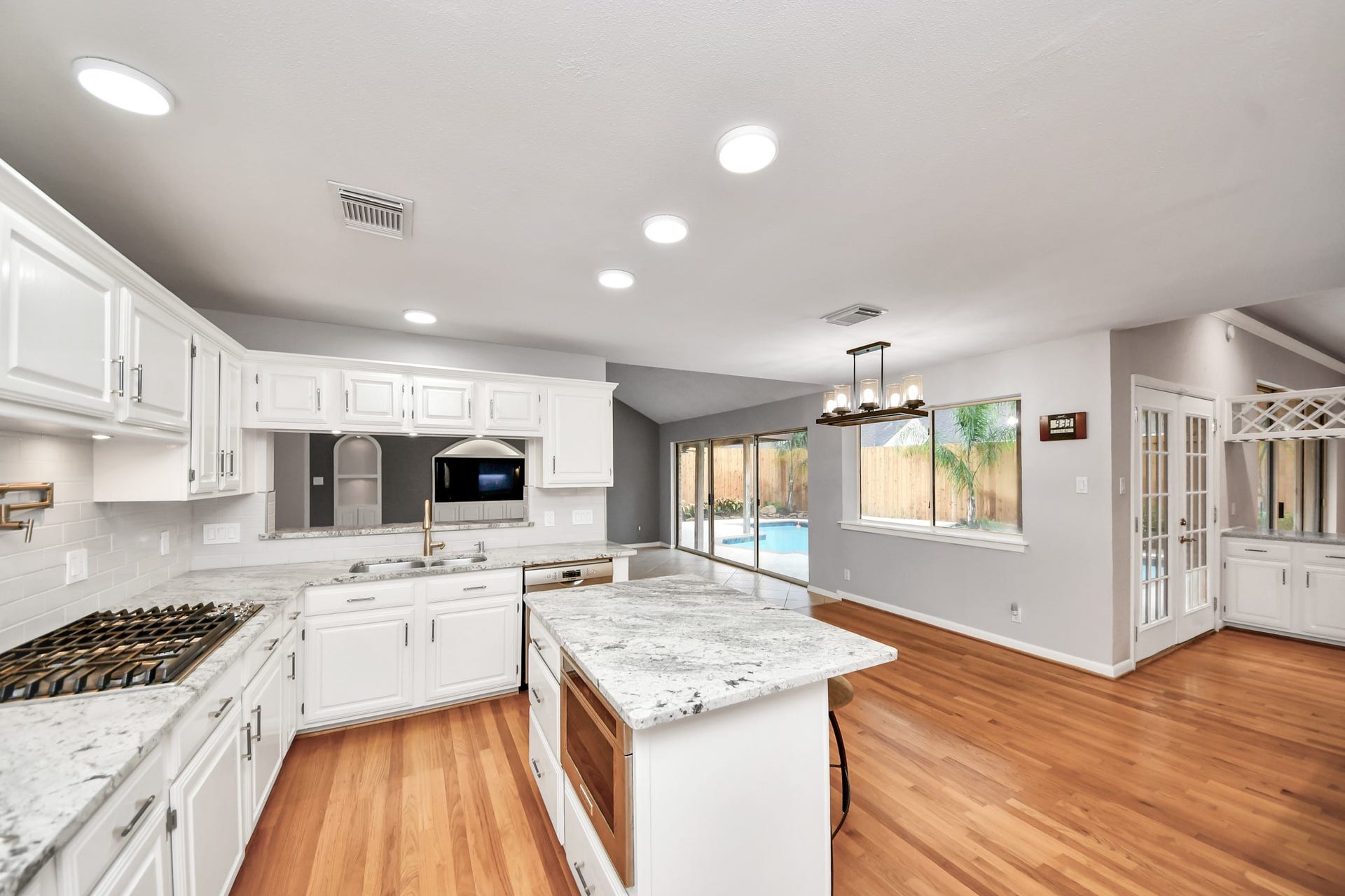 An open view from the kitchen shows the easy connection to the breakfast room and adjoining living spacesideal for everyday living and entertaining.