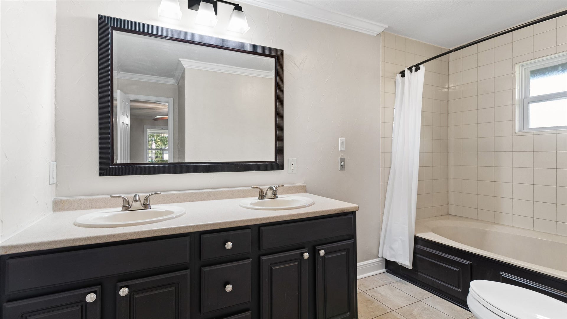12335 2nd Street, Santa Fe, TX 77510 Second bathroom with double vanities & tub/shower combo