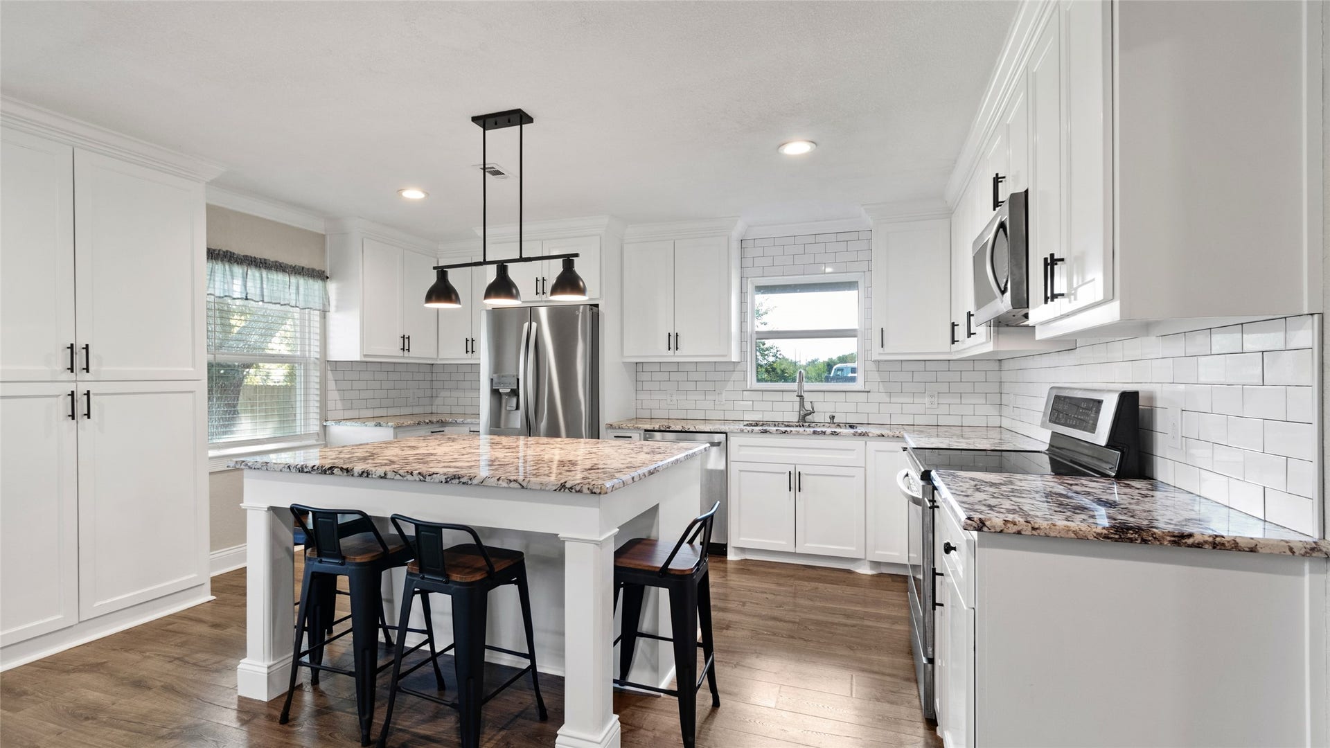 12335 2nd Street, Santa Fe, TX 77510 Kitchen with island and stainless steel appliances