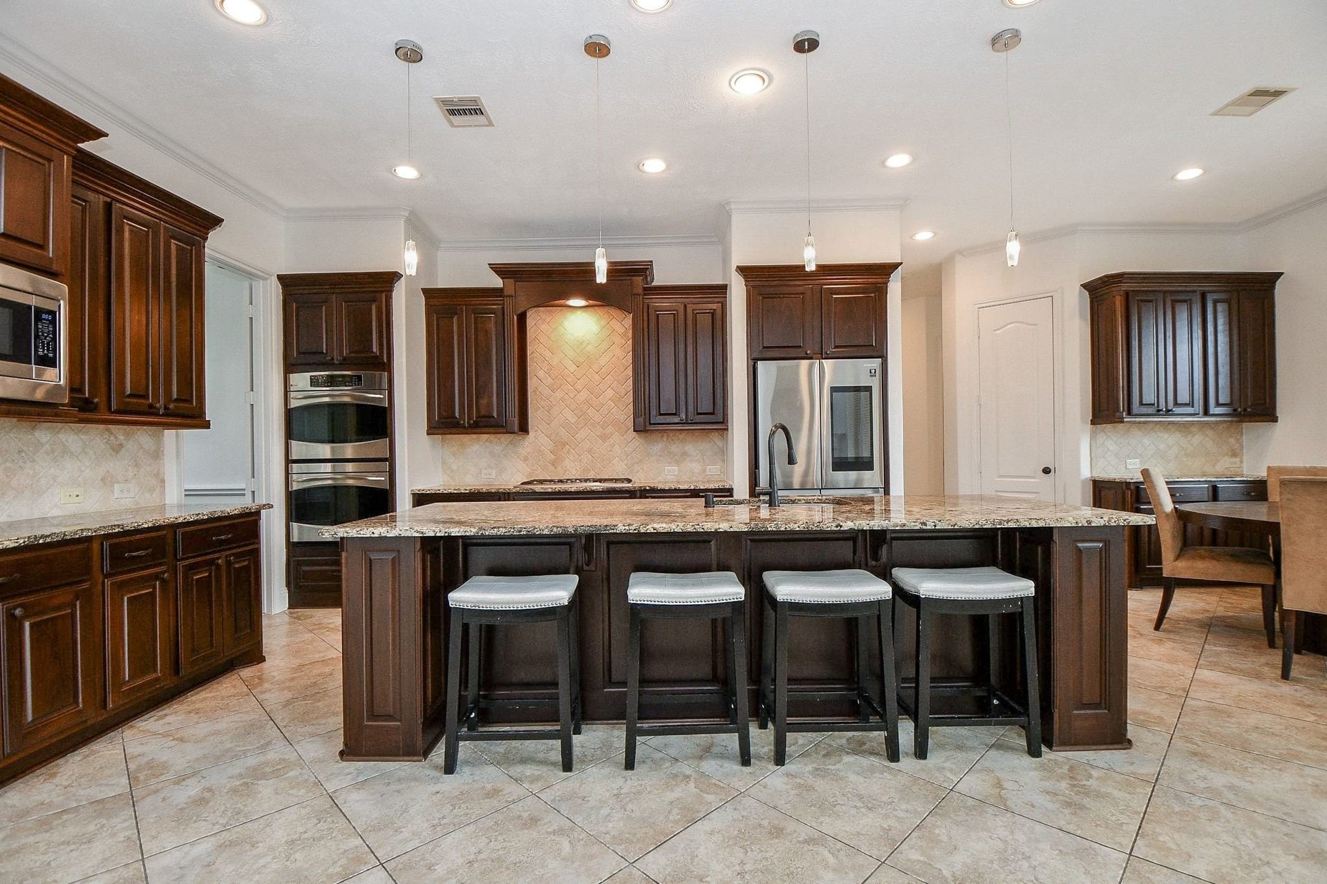 26727 Cedardale Pines Drive, Katy, TX 77494 Beautifully elegant kitchen with granite counters...
