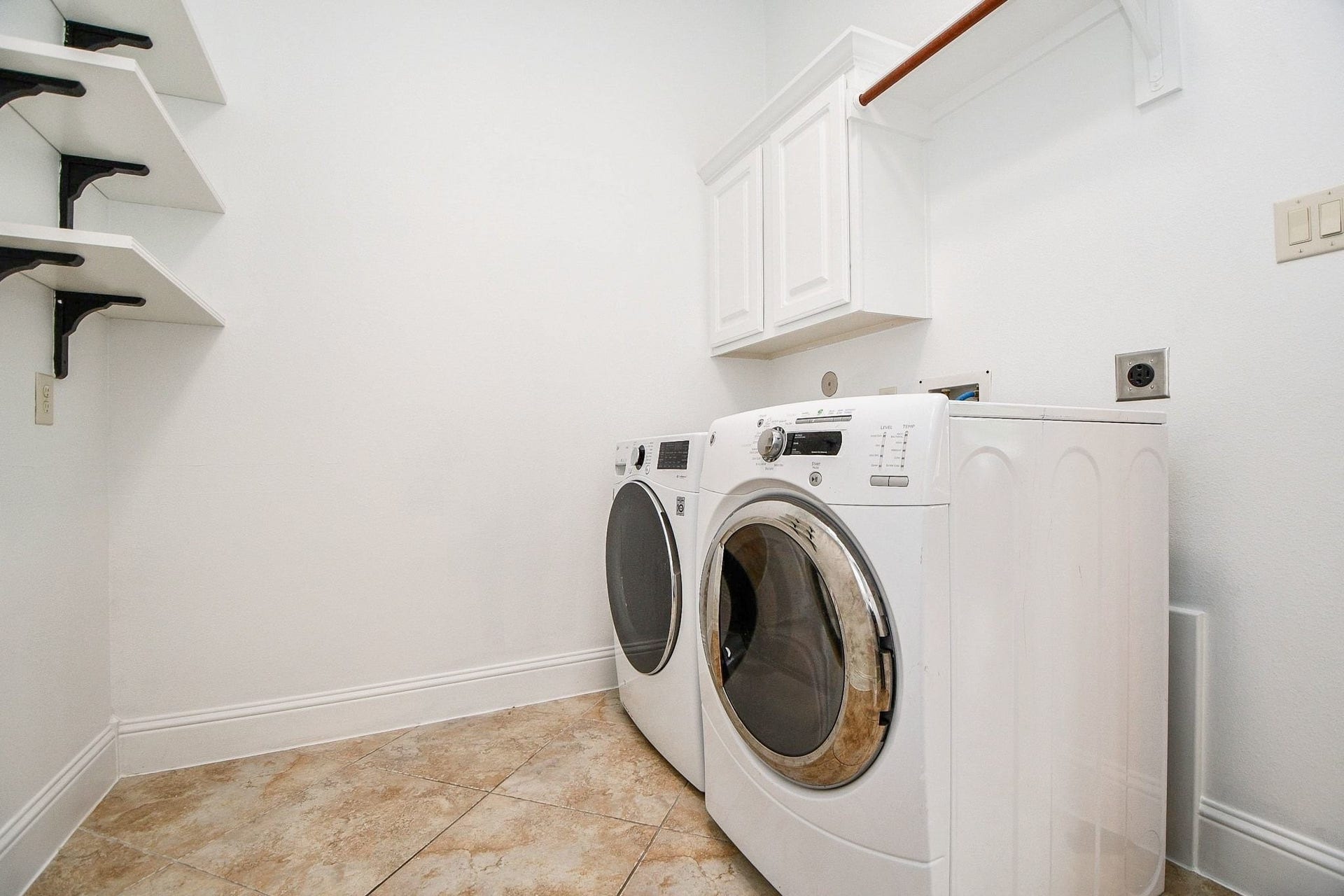 26727 Cedardale Pines Drive, Katy, TX 77494 Utility room with Washer/Dryer with shelving and backpack rack.