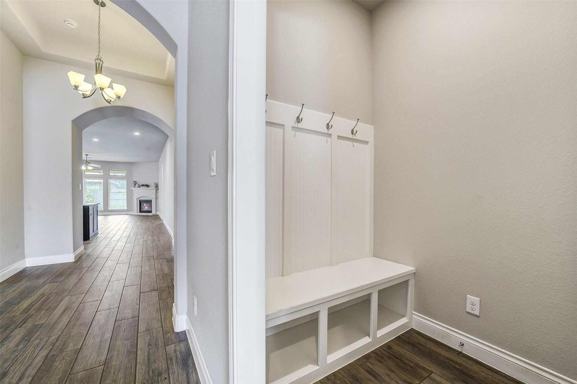 16818 Headwaters Forest Drive, Humble, TX 77346 Convenient mudroom with built-in bench and coat hooks, providing the perfect drop zone.