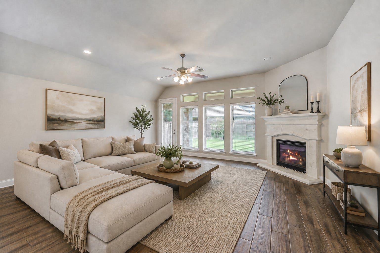 16818 Headwaters Forest Drive, Humble, TX 77346 Virtually staged living room showcasing a warm modern layout with fireplace views, layered textures, and open flow.