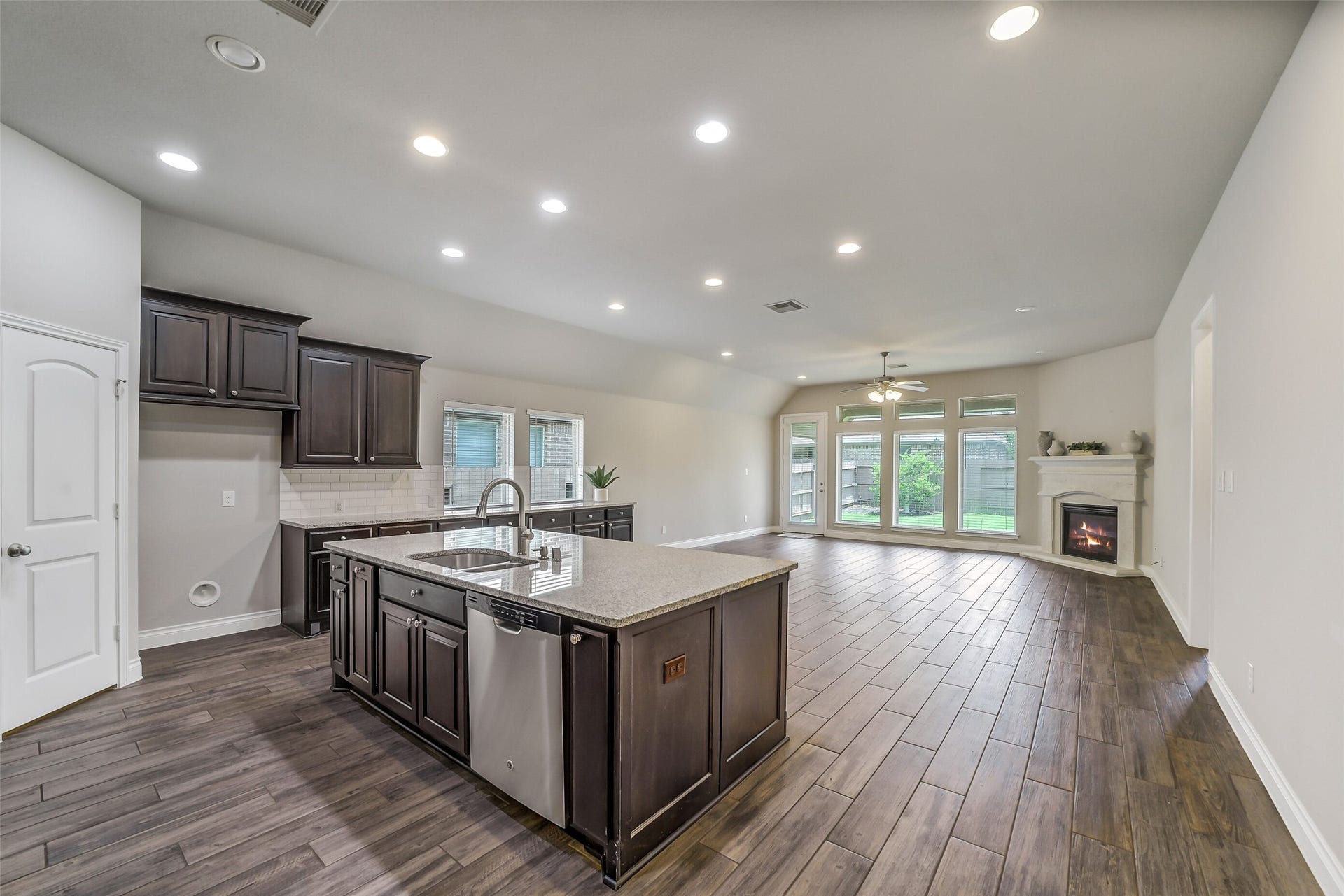 16818 Headwaters Forest Drive, Humble, TX 77346 Spacious open-concept living area seamlessly connecting the gourmet kitchen, dining, and living room, perfect for everyday living and entertaining.