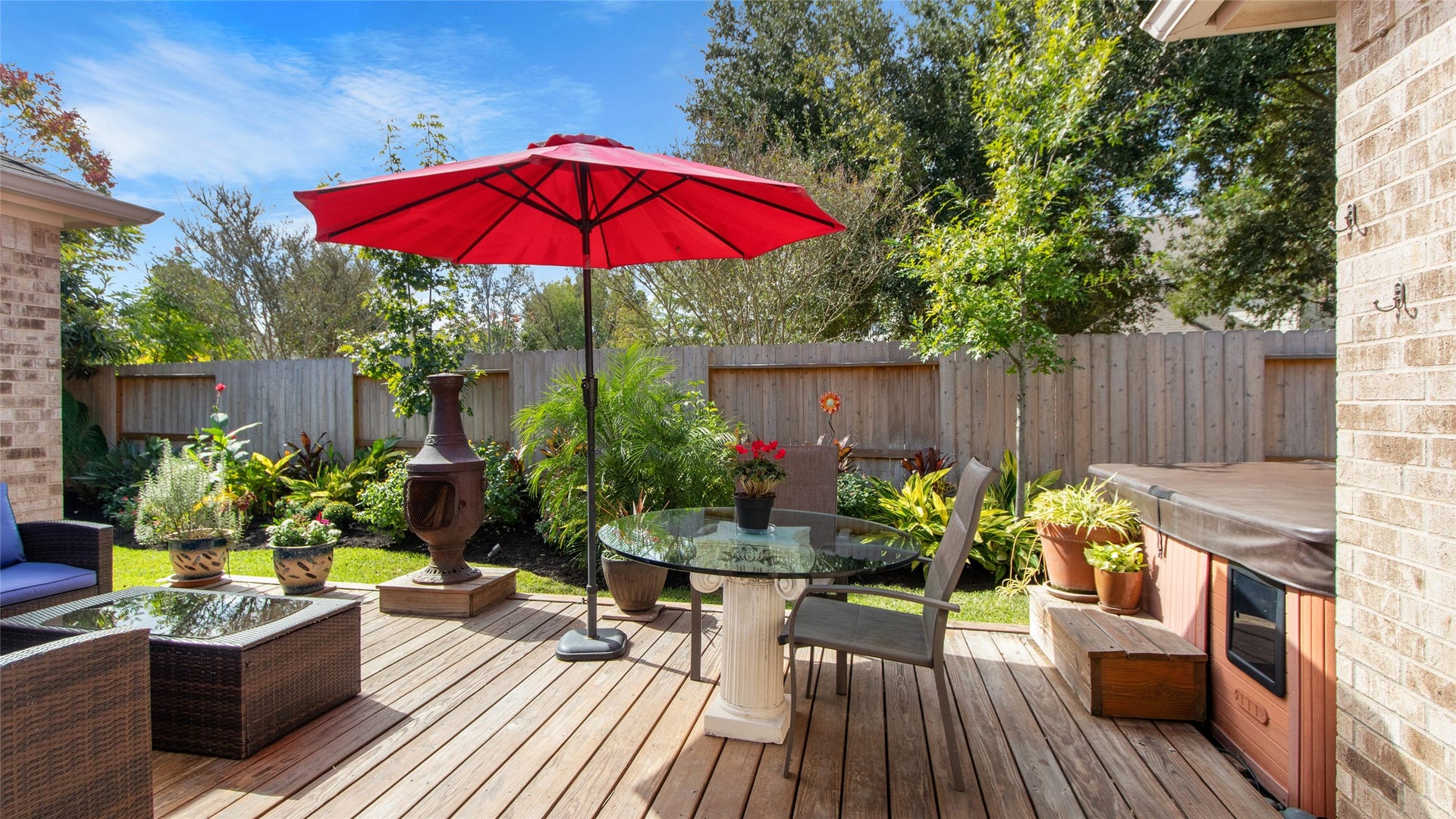 1170 Rustling Wind Lane, League City, TX 77573 Step onto your back deck and enjoy the beautiful landscaping.