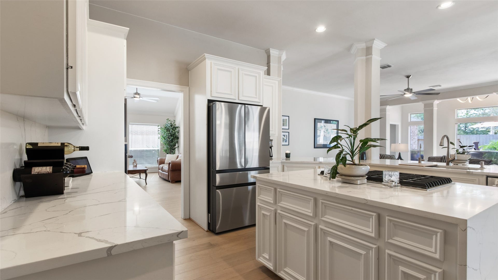 1170 Rustling Wind Lane, League City, TX 77573 This kitchen was tastefully updated in 2025 with new appliances and quartz counters, with a waterfall edge.