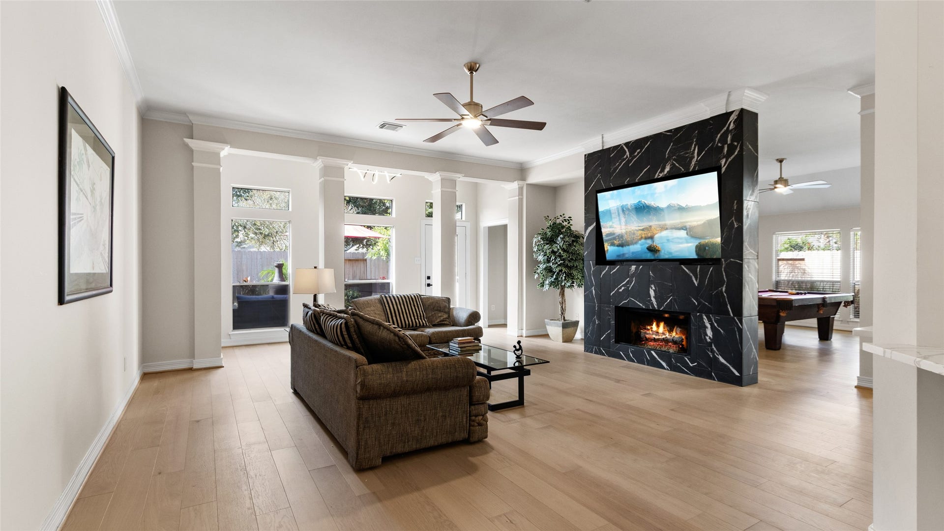 1170 Rustling Wind Lane, League City, TX 77573 The spacious Family Room has loads of natural light. The TV comes with the house.