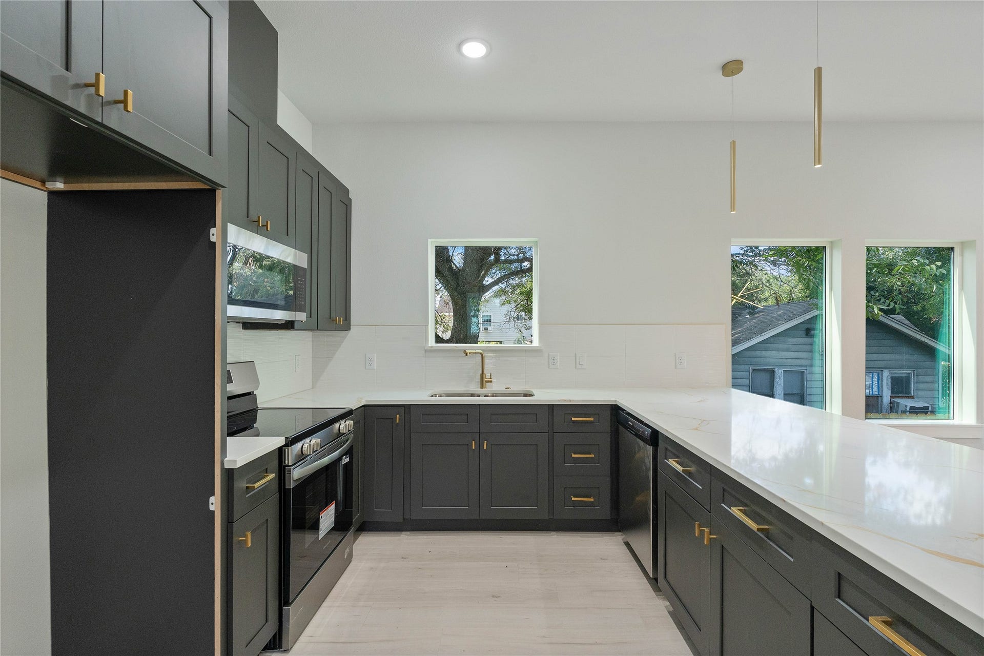 1216 Johnston Street, #A, Houston, TX 77022 Chrome Appliance in Kitchen.