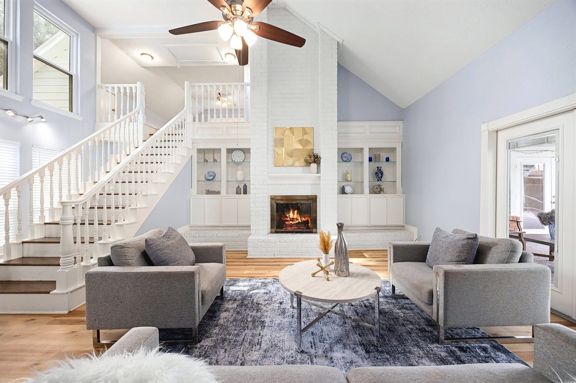20102 Wickham Court, Katy, TX 77450 Family room with vaulted ceilings, fireplace, large windows, and abundant natural light.